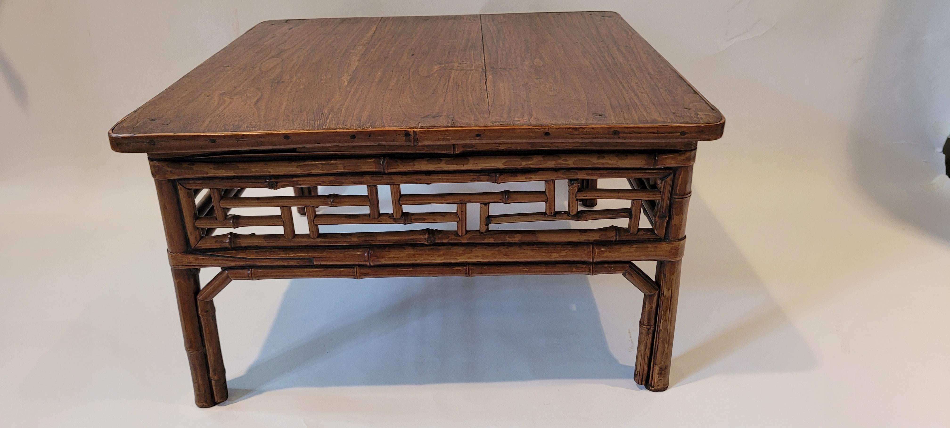 Bamboo Low Table 13H x 23W x 22.5D
A square low table with geometric fretwork decoration. The legs are held together with double wrapped around stretchers. These stretchers also help to strengthen the structure of the table. In between the legs are