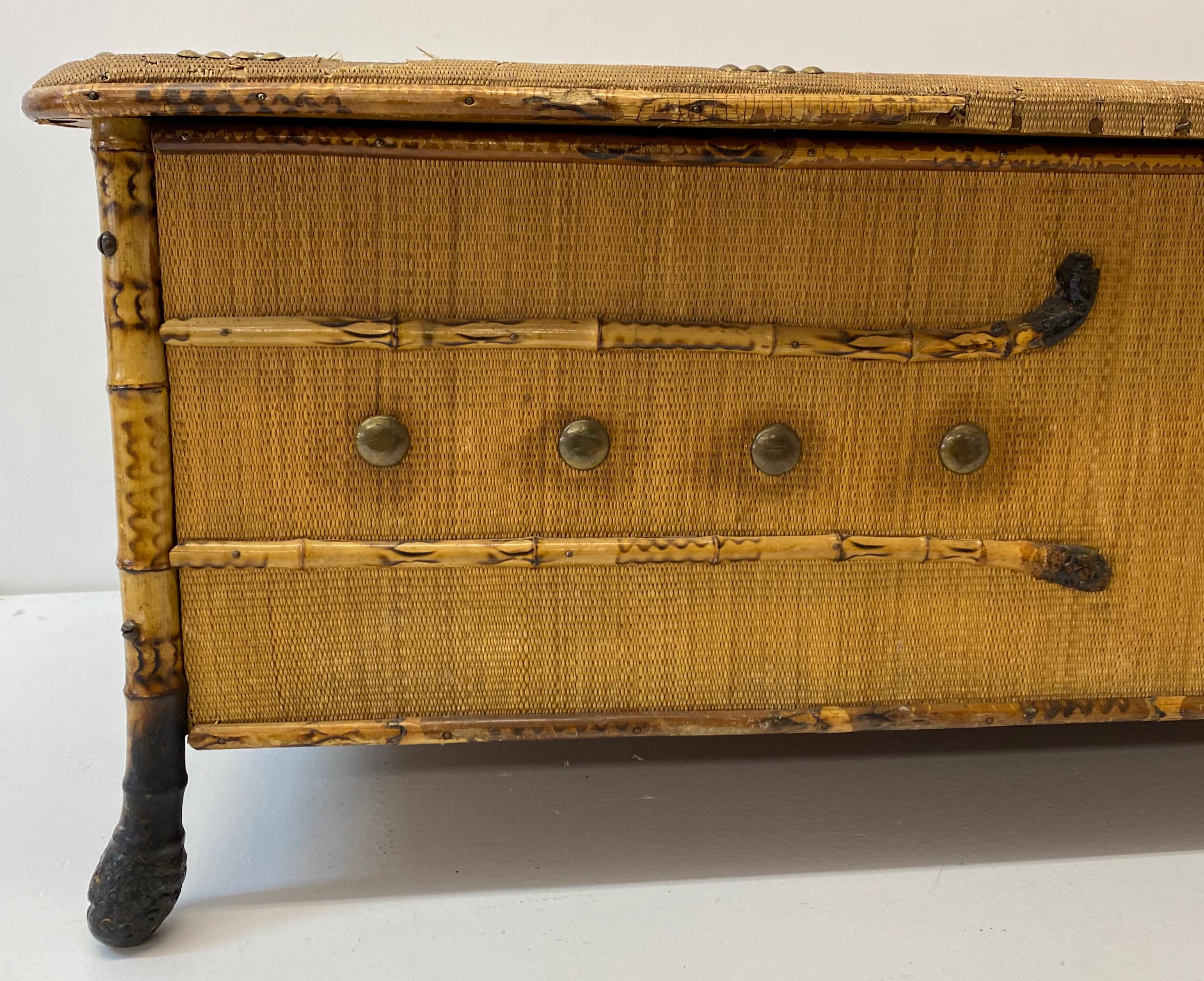 19th century bamboo & rattan blanket / games trunk

Fine old chest, or trunk made with bamboo and rattan

The rattan shows some distress (please see all images) This is consistent with pieces of this age.

Some brass tack decoration along the