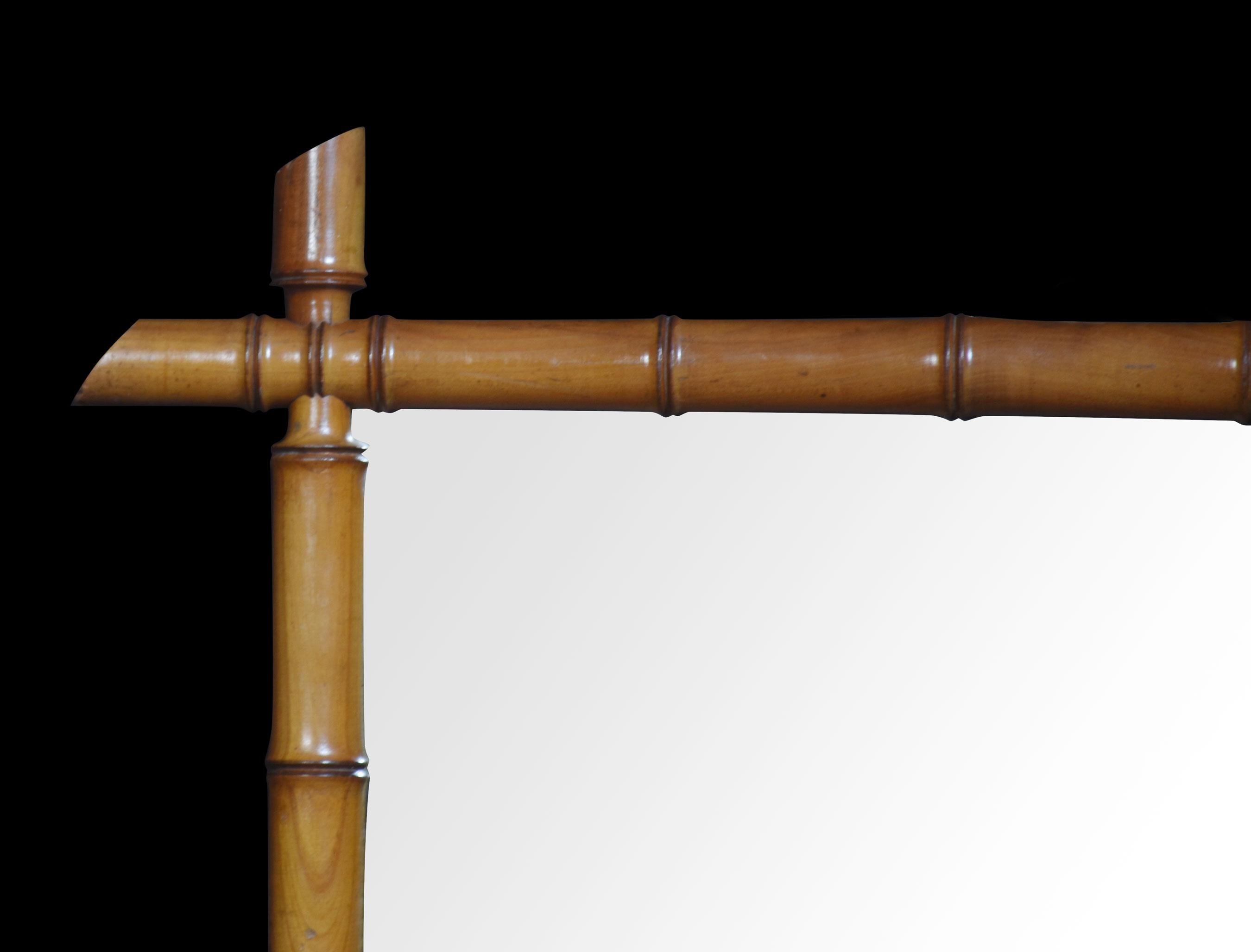 19th-century wall mirror, the simulated bamboo frame encasing the original mirror plate.
Dimensions
Height 28.5 Inches
Width 22.5 Inches
Depth 2 Inches