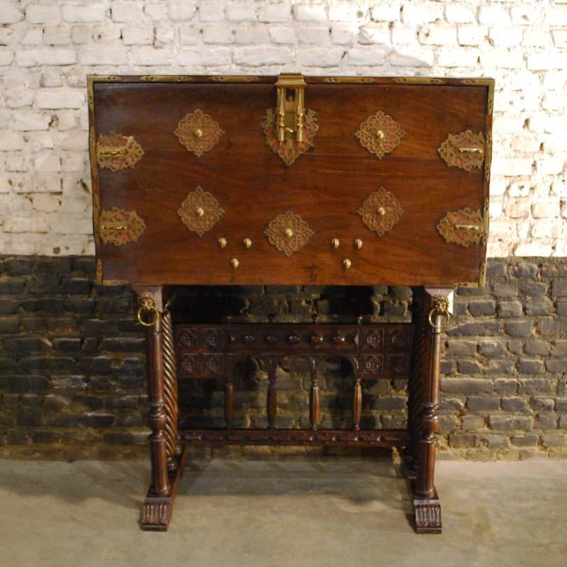 This beautiful Spanish baroque desk (bargueno) is made in solid walnut wood and was made around 1880. This typical Spanish desk with drop down front has been decorated with many brass applications. These applications are ajour cut, (open work) with