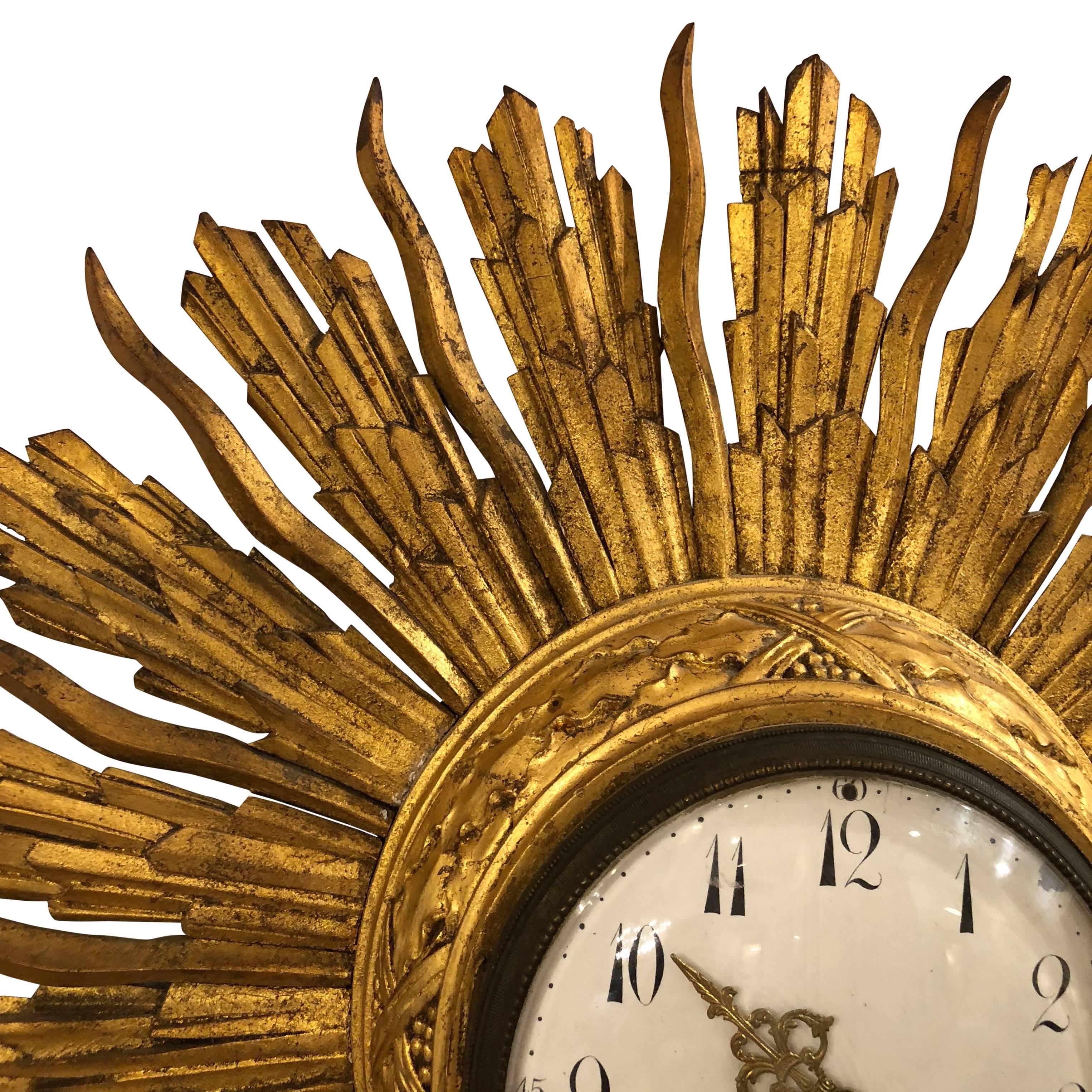 Giltwood starburst barometer clock from France in the 19th century.