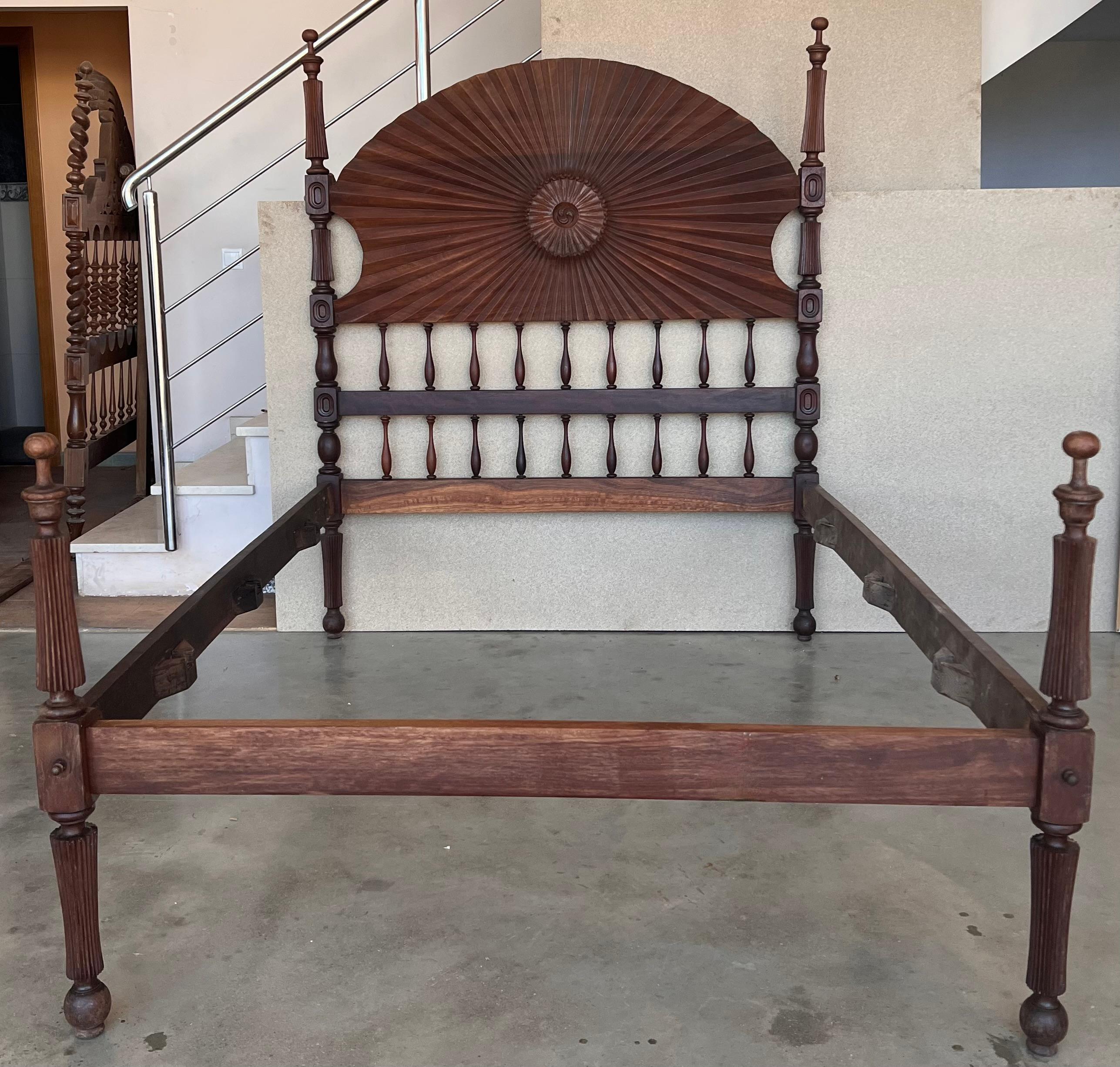 19th Century baroque bed, original Spanish bed.

This queen size 4-poster bed is hand carved with elaborate details, fluted turned post, 3D open spiral twist spindles, and moorish details represented by the repetition of arches. It is carved and