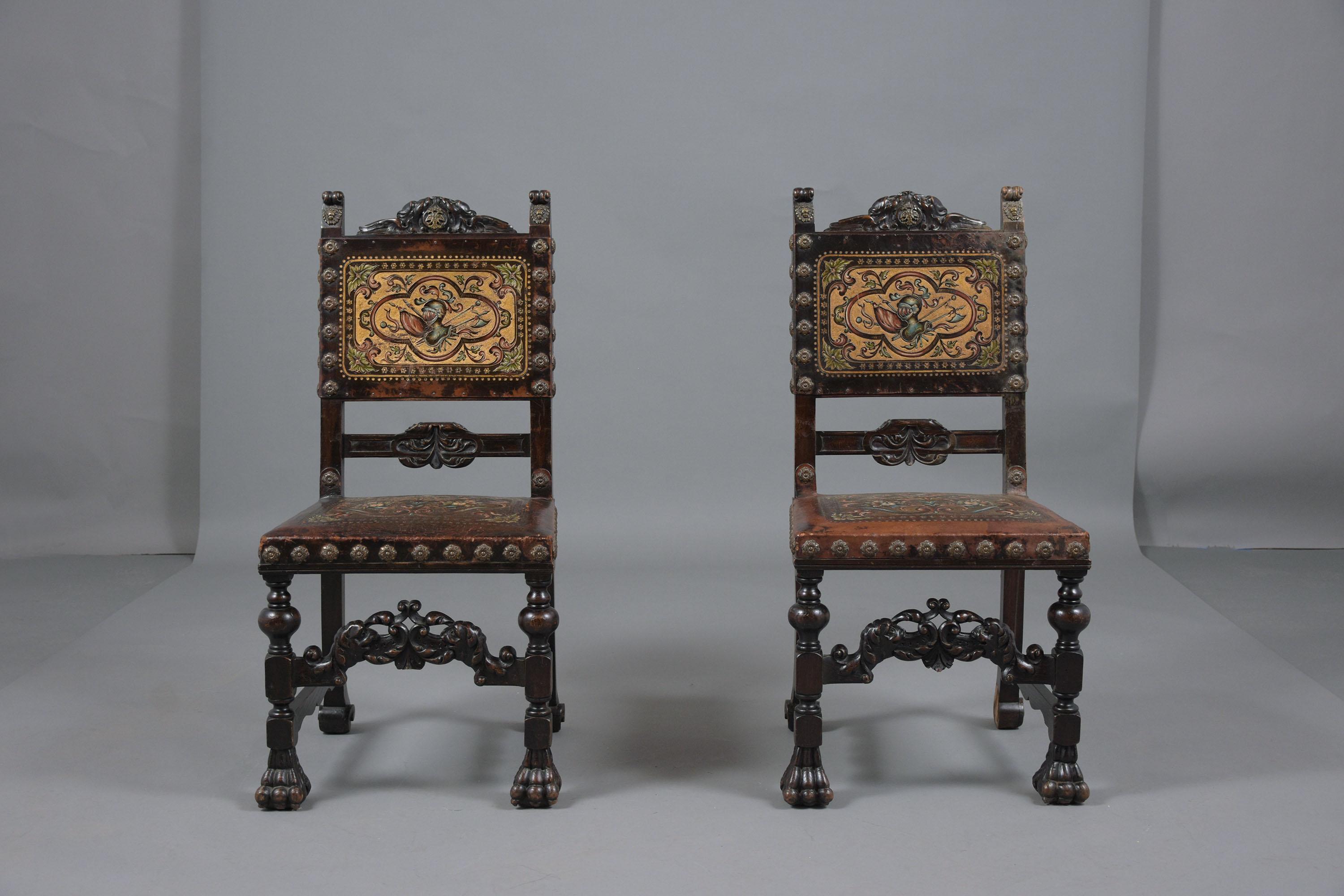 A pair of antique baroque chairs hand-crafted out of walnut wood in a good condition and has been restored by our team of expert craftsmen. This set of dining chairs features a dark walnut color with a beautiful patina finish, hand-carved details