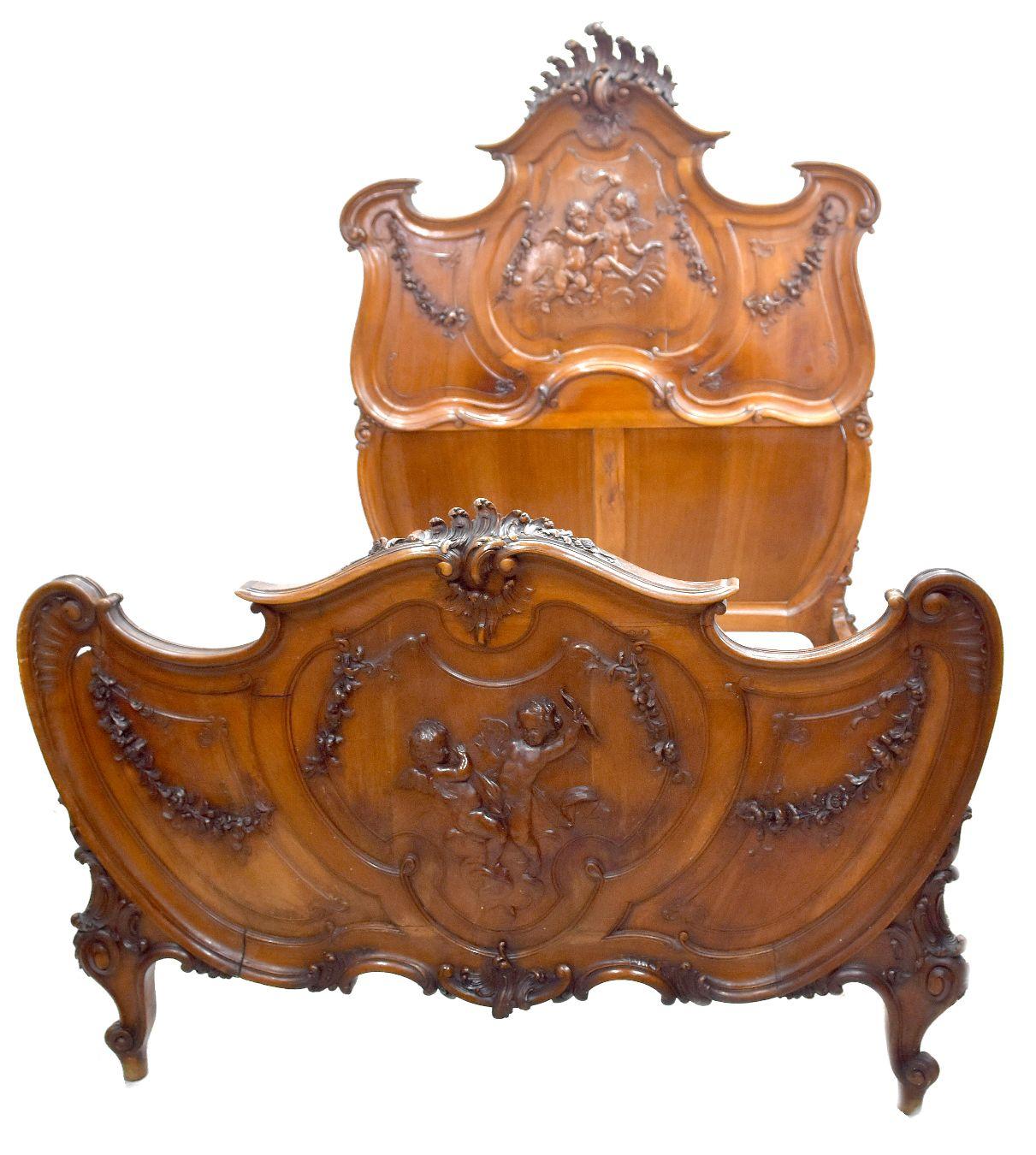 19th Century Exceptional baroque Louis XV style bed in walnut carved for babies Louis XV style bed in Provençal walnut richly carved and engraved XIXth century decorated with acanthus leaves and snail feet. Interior bed frame 194 cm by 130 cm. Part