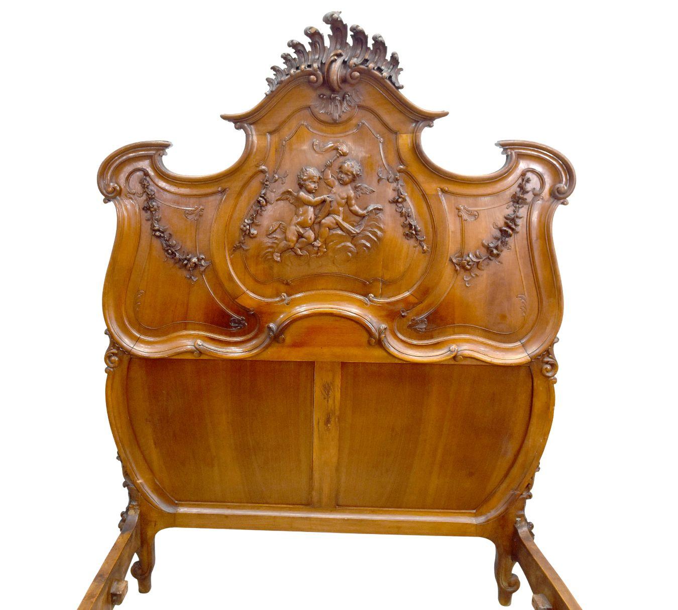 French 19th Century Baroque Louis XV Style Bed in Walnut Carved with Putti For Sale