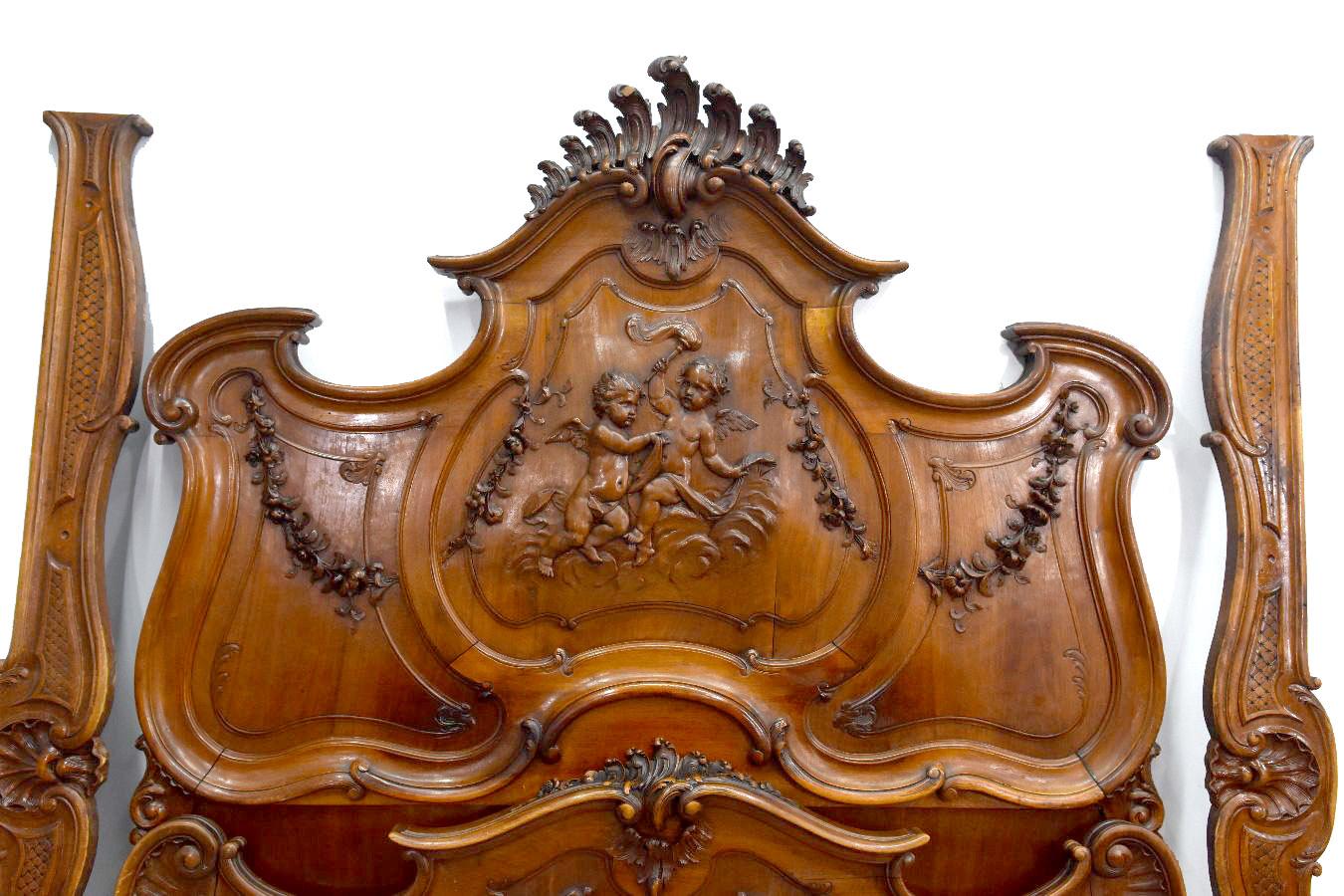 Wood 19th Century Baroque Louis XV Style Bed in Walnut Carved with Putti For Sale