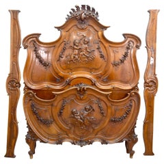 19th Century Baroque Louis XV Style Bed in Walnut Carved with Putti