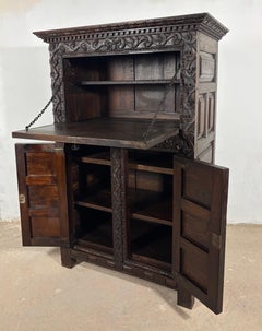19th Century Baroque Oak Fall-Front Cabinet with Deep Carved Decoration