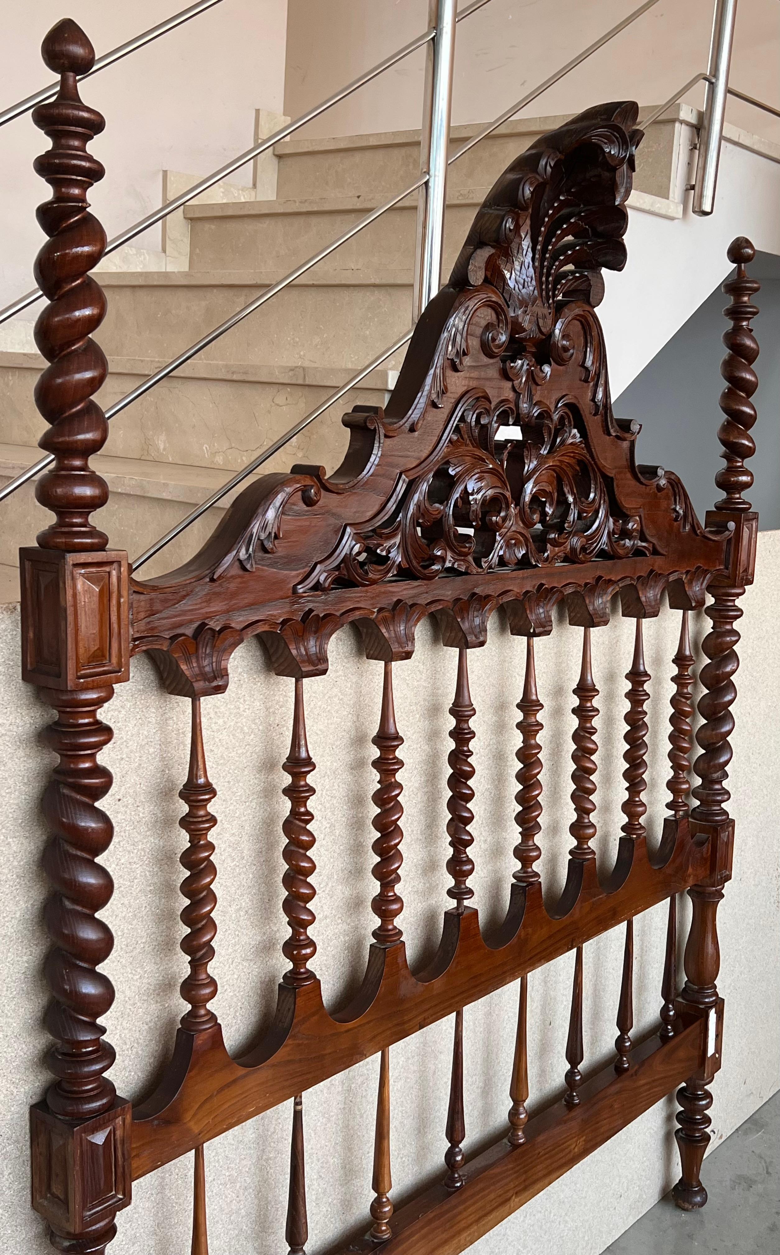 19th century Baroque bed, original Spanish bed.

This queen size 4-poster bed is handcarved with elaborate details, fluted turned post, 3D open spiral twist spindles, and Moorish details represented by the repetition of arches. It is carved and