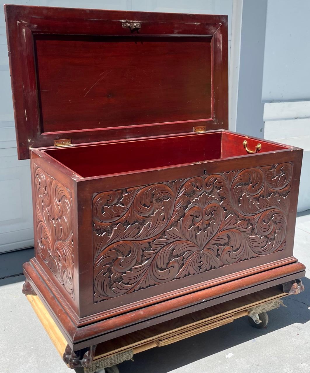 19th Century baroque revival carved wooden blanket chest.

Elaborately carved wood chest in superb quality. Floral motif in relief on all sides. The top is adorned with the same floral elements. Artfully carved lion paws on all four corners. The