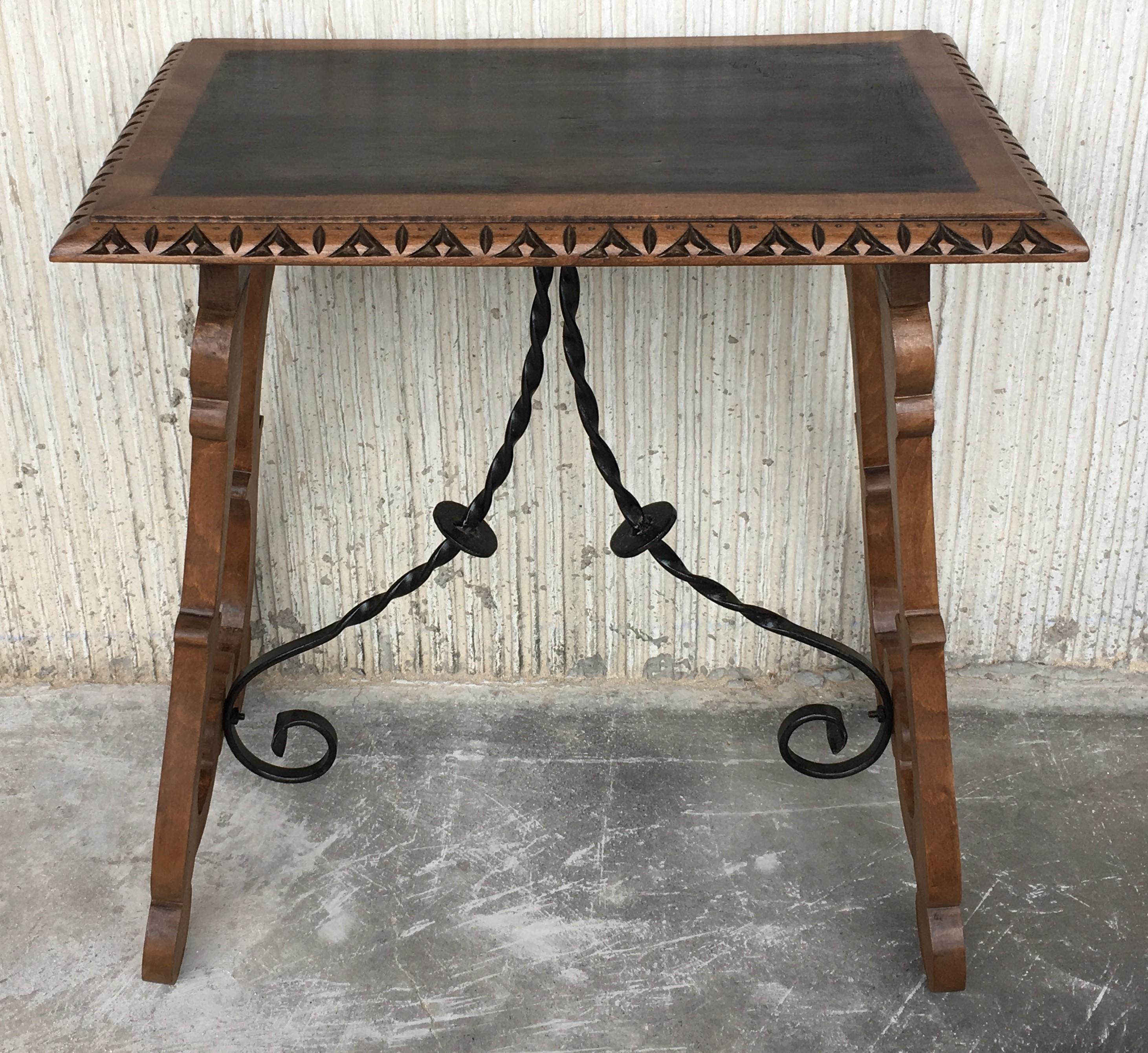 19th century Spanish trestle table in mahogany. This piece has a great scale, lovely carved lyre legs and beautiful ebonized top. This table could be used as an end table, nightstand, side table or small desk.
Restored.