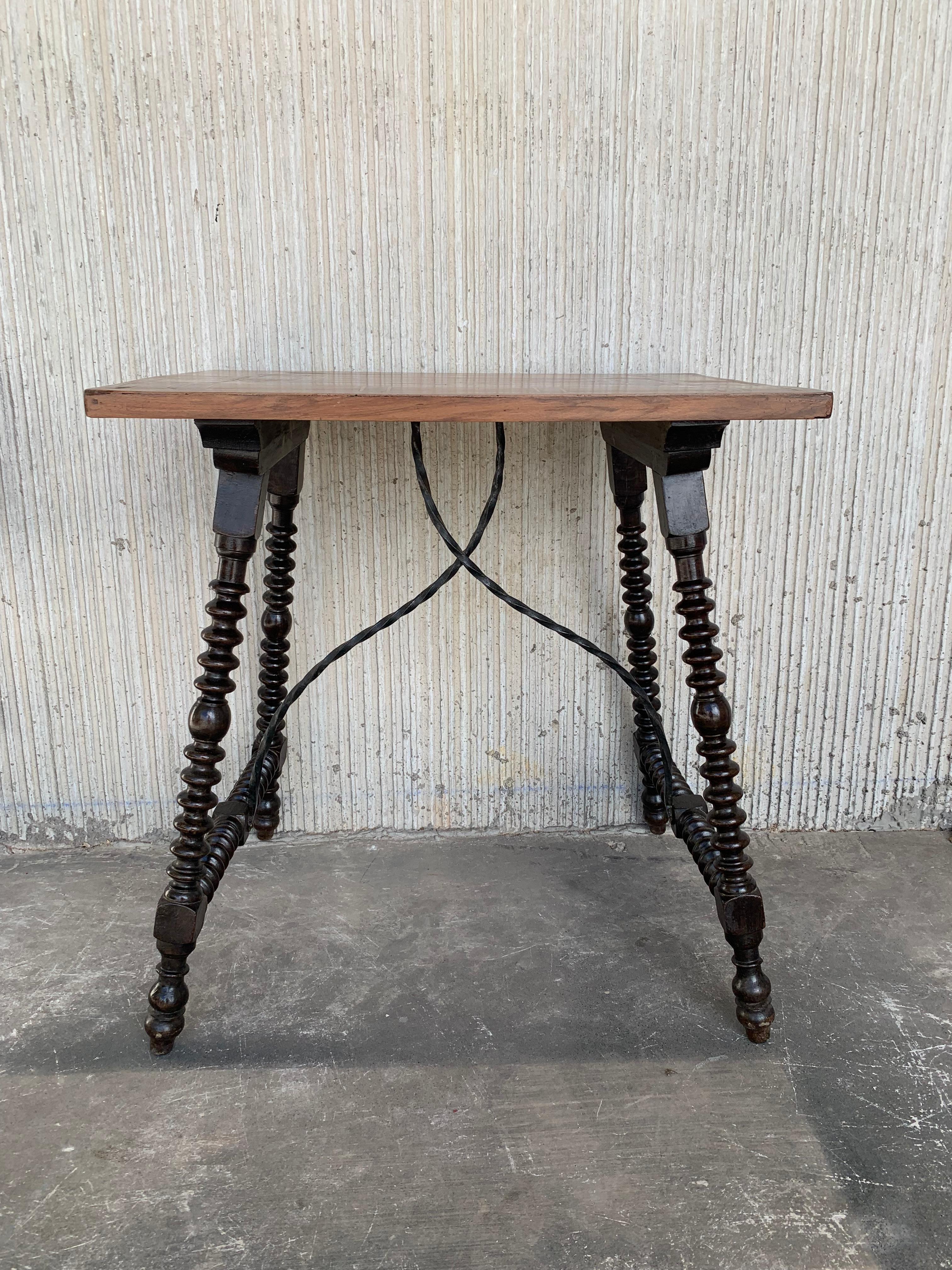 19th century Baroque Spanish side table with marquetry top

19th century Spanish trestle table in walnut. This piece has a great scale, lovely turned legs and beautiful marquetry top. . This table could be used as an end table, nightstand, side