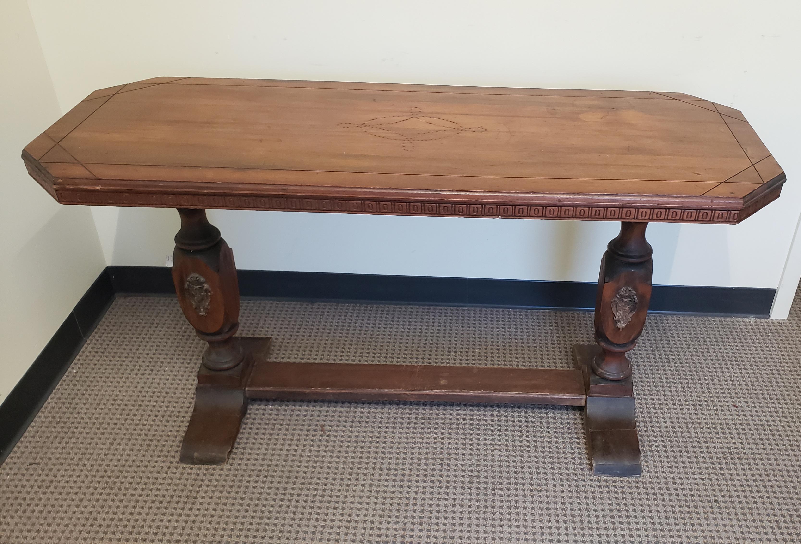 19th century Baroque Style walnut trestle base library table. Measures 53.5