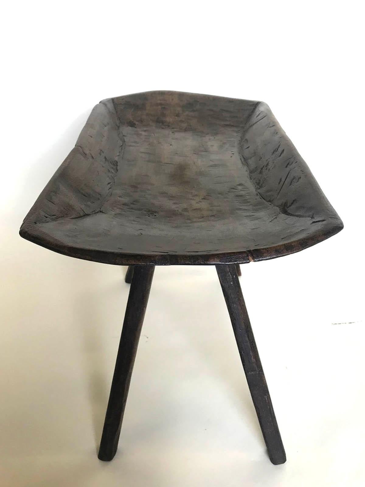 A side table made from an antique, 19th century wooden tray from Guatemala. Legs have been added and matched to top. Great little catch all side table. Beautiful dark patina.