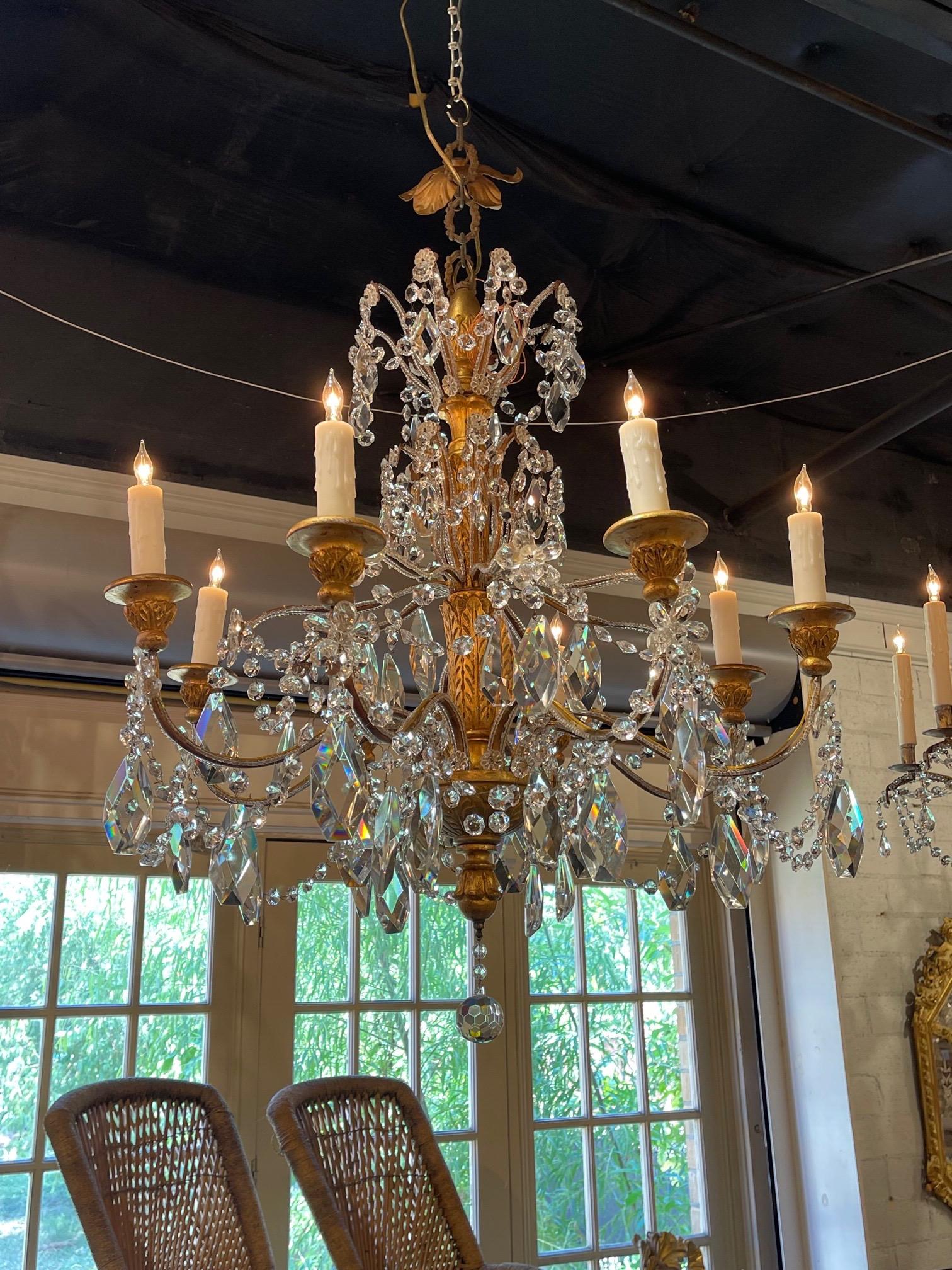 Very fine 19th century beaded crystal and giltwood 8 light chandelier. Lovely carved base and variety of gorgeous crystals and beads. Creates a beautiful classic look!