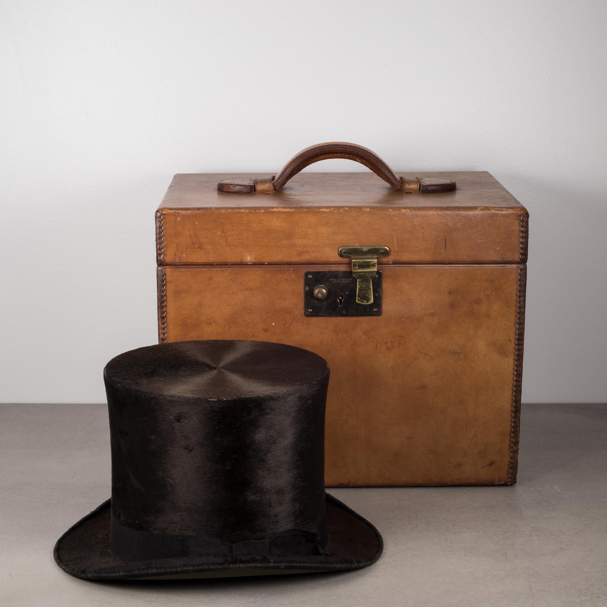 Dunlap and Co. beaver skin top hat and original leather hat box by Collins and Fairbanks. Made in England. 
Hat box has brass latch, original key, original hat brush and hand held brush. 
Measure: Hat 6.5