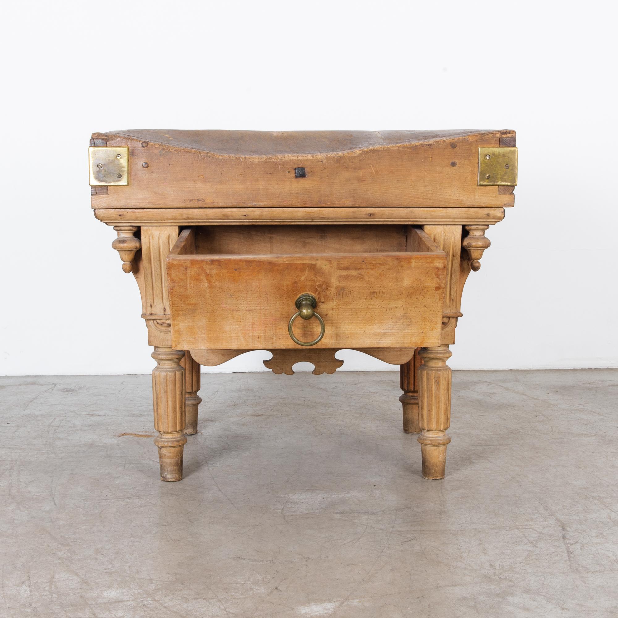 Ornate butcher block table from the late 19th century. with wonderful architectural style moulding details and original hardware. This Belgian table has great character, with a deeply textured top, worn from years of work, and held together by