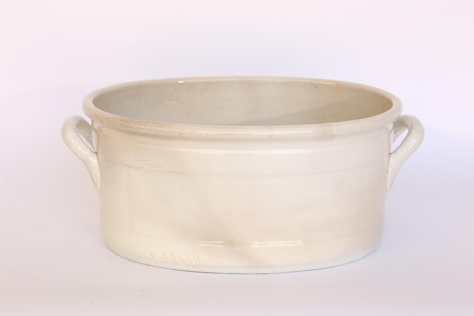 This is a lovely Belgian foot bath made by Petrus Regout & Co. ( The Royal Sphinx Factory) in the late 19th century. The Royal Sphinx factory was established by Petrus Regout in 1834 and located in Maastricht, Holland. This piece has many potential