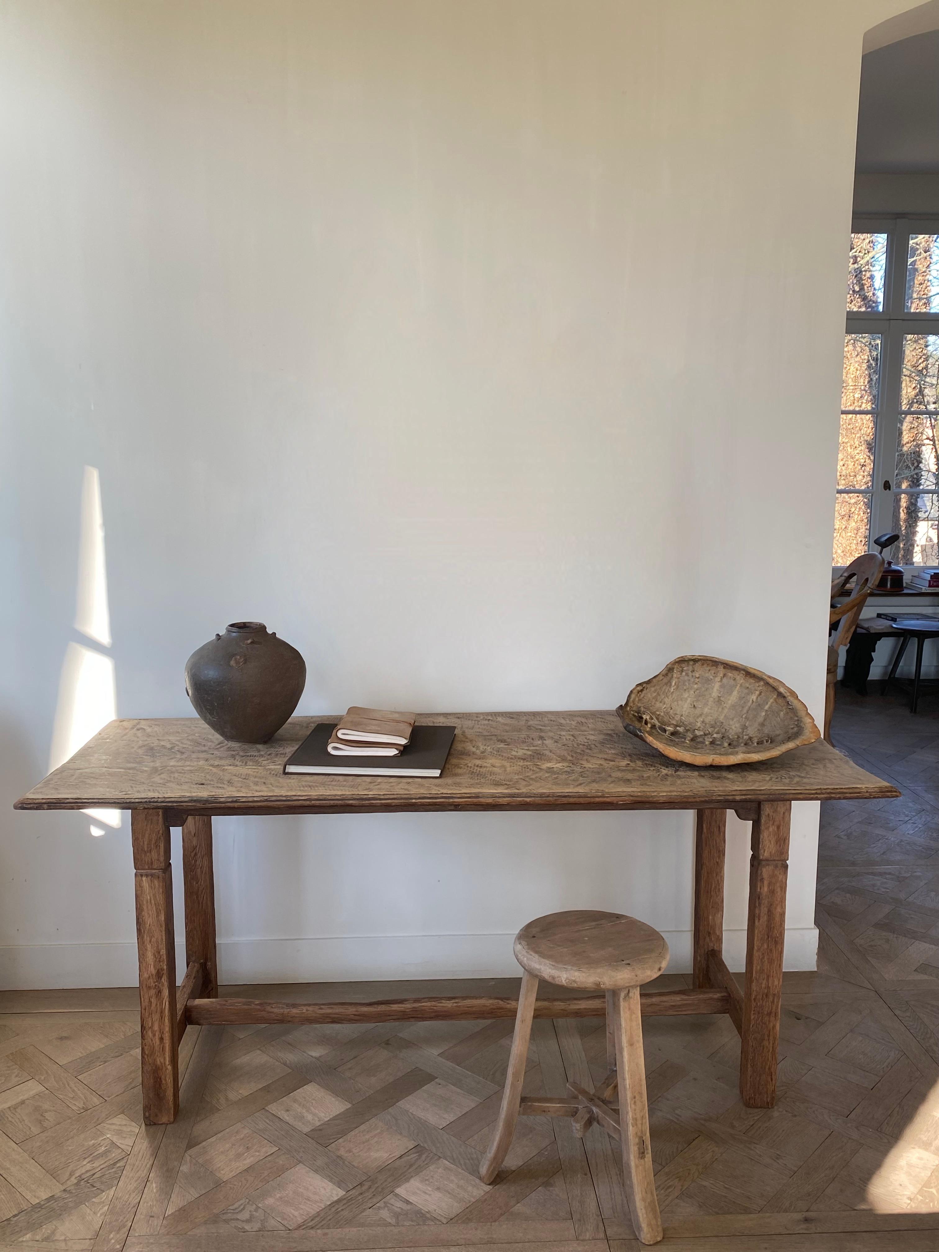 This minimalist oak table has been used for decades as a work table at a Belgian baker to knead the dough.

The tablet has a very beautiful patina due to intensive use.

In its simplicity a beautiful writing table, which is very sturdy.


We