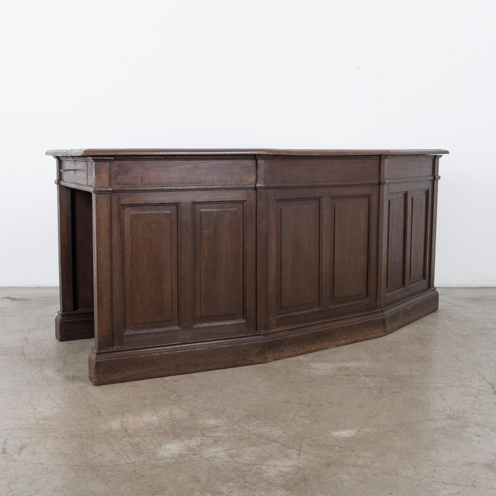 A unique shaped oak desk from the late 19th century. Originally built for a Belgian 