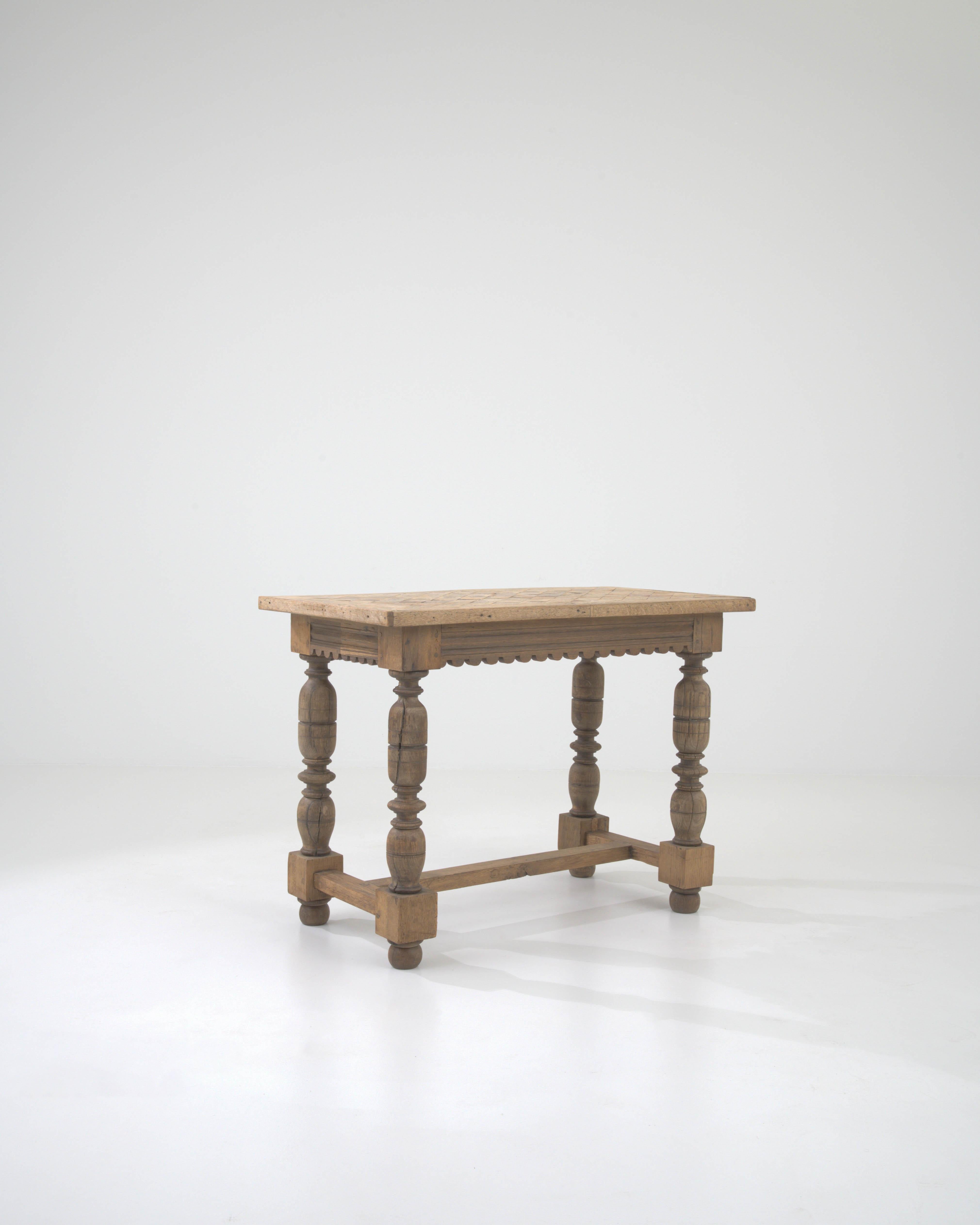 Transport yourself to the 19th century with this exquisite Belgian Wooden Side Table, a testament to the artistry of handcrafted furniture. Standing at 29.4 inches in height, it features meticulous hand-carvings that adorn the entire piece,