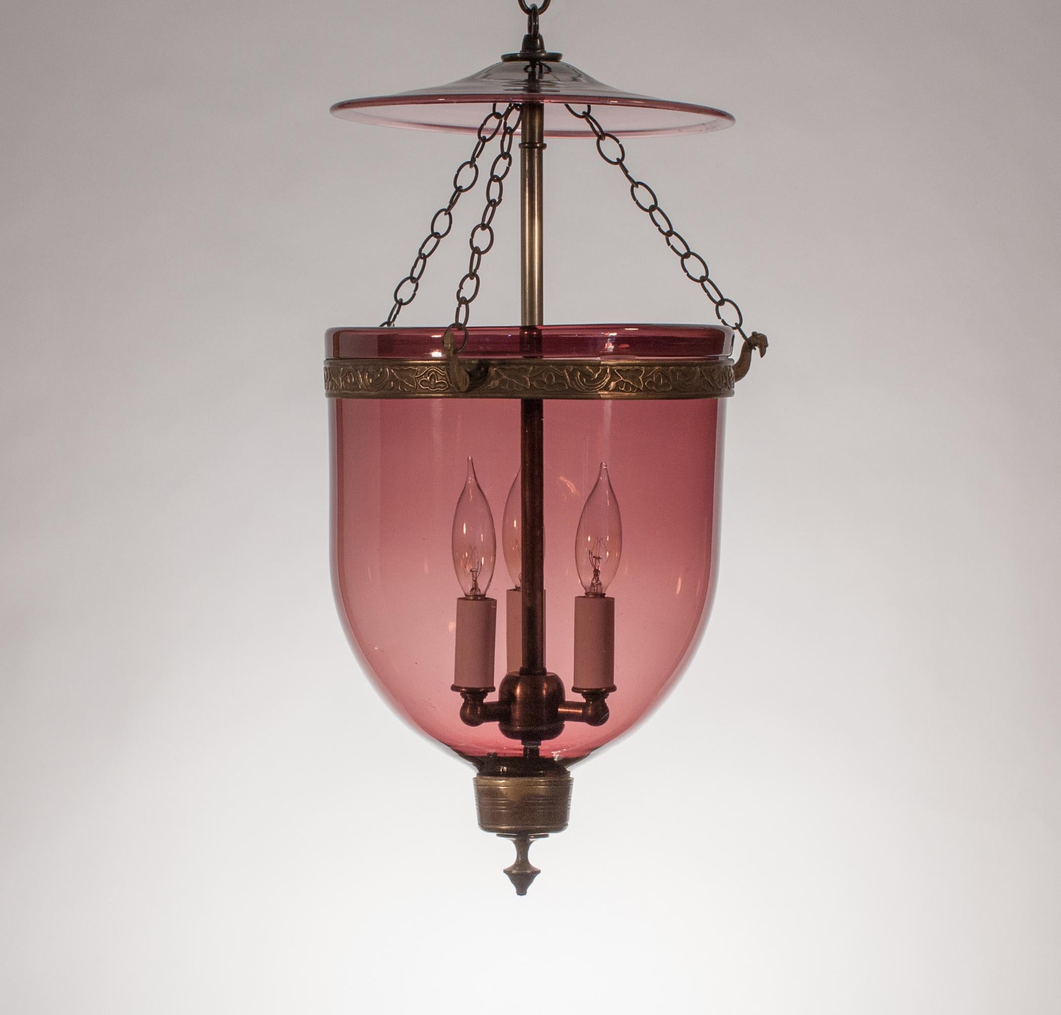 A truly beautiful Amethyst bell jar lantern from England. This circa 1860 lantern has Classic form, and the colored glass emanates a very subtle hue. The pendant is in very good condition, with several desirable bubbles and swirls in the hand blown