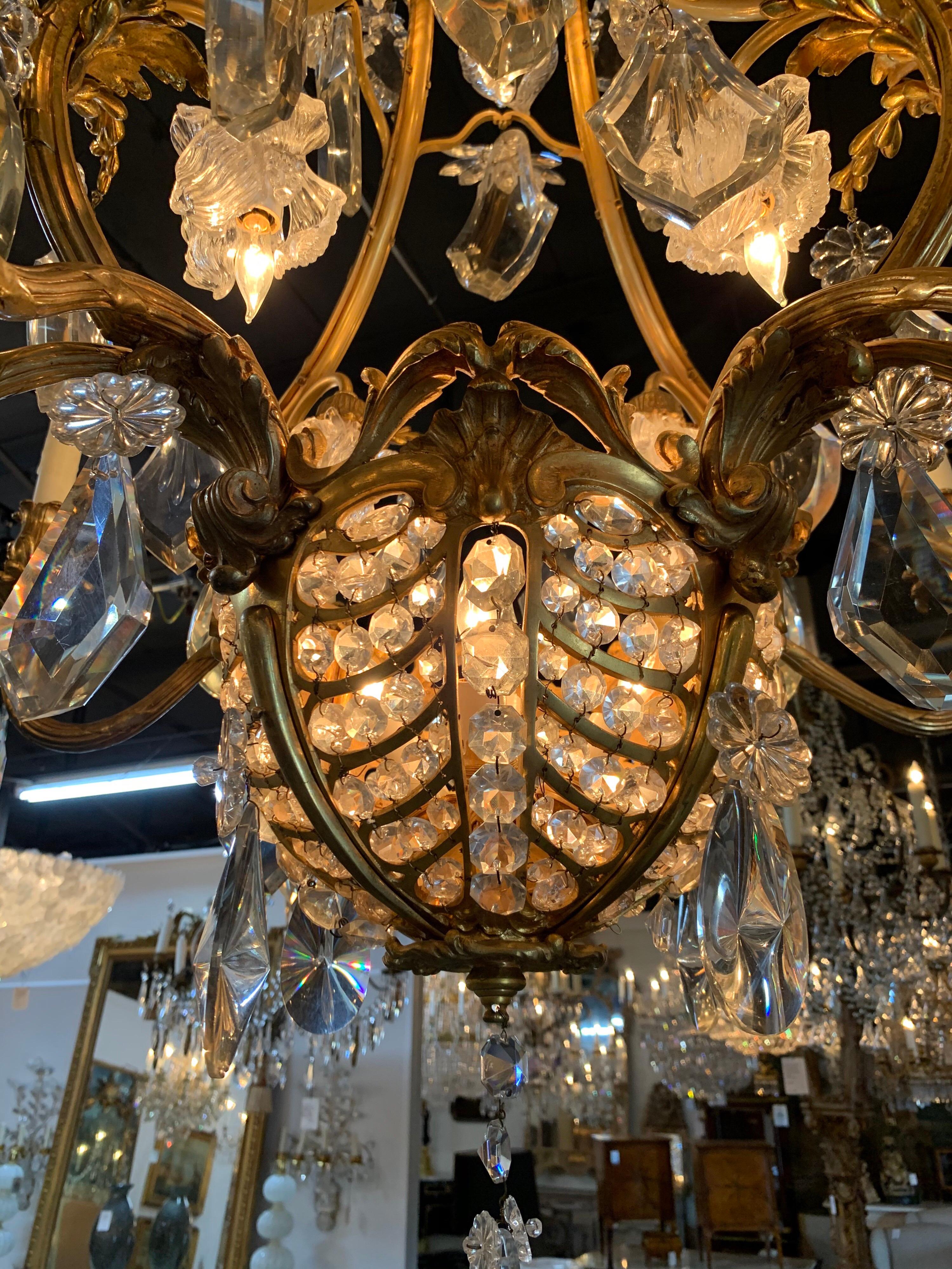 Truly exceptional 19th century belle epoche bronze and crystal chandelier. The crystals are amazing on this fixture and are possibly Baccarat. Lighting is especially pretty, with some of the lights inside a cluster of crystals. The bronze is also