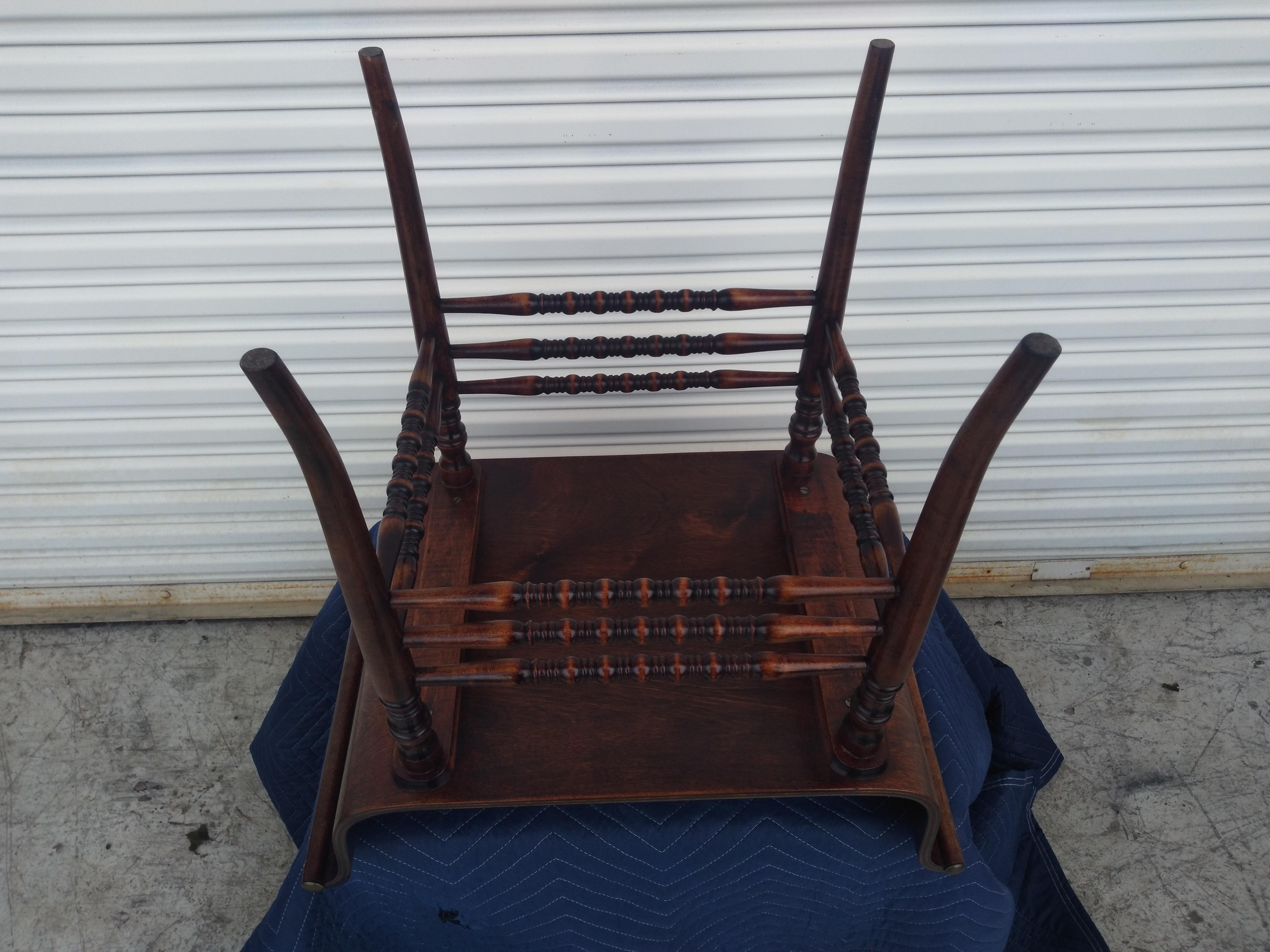 This is a beautiful unusual vanity stool . Made with a bentwood seat that ends in brass tip scrolling, it quite eye catching and comfortable. The legs are made of turned legs that have multiple turned stretches that provide superior stability. This