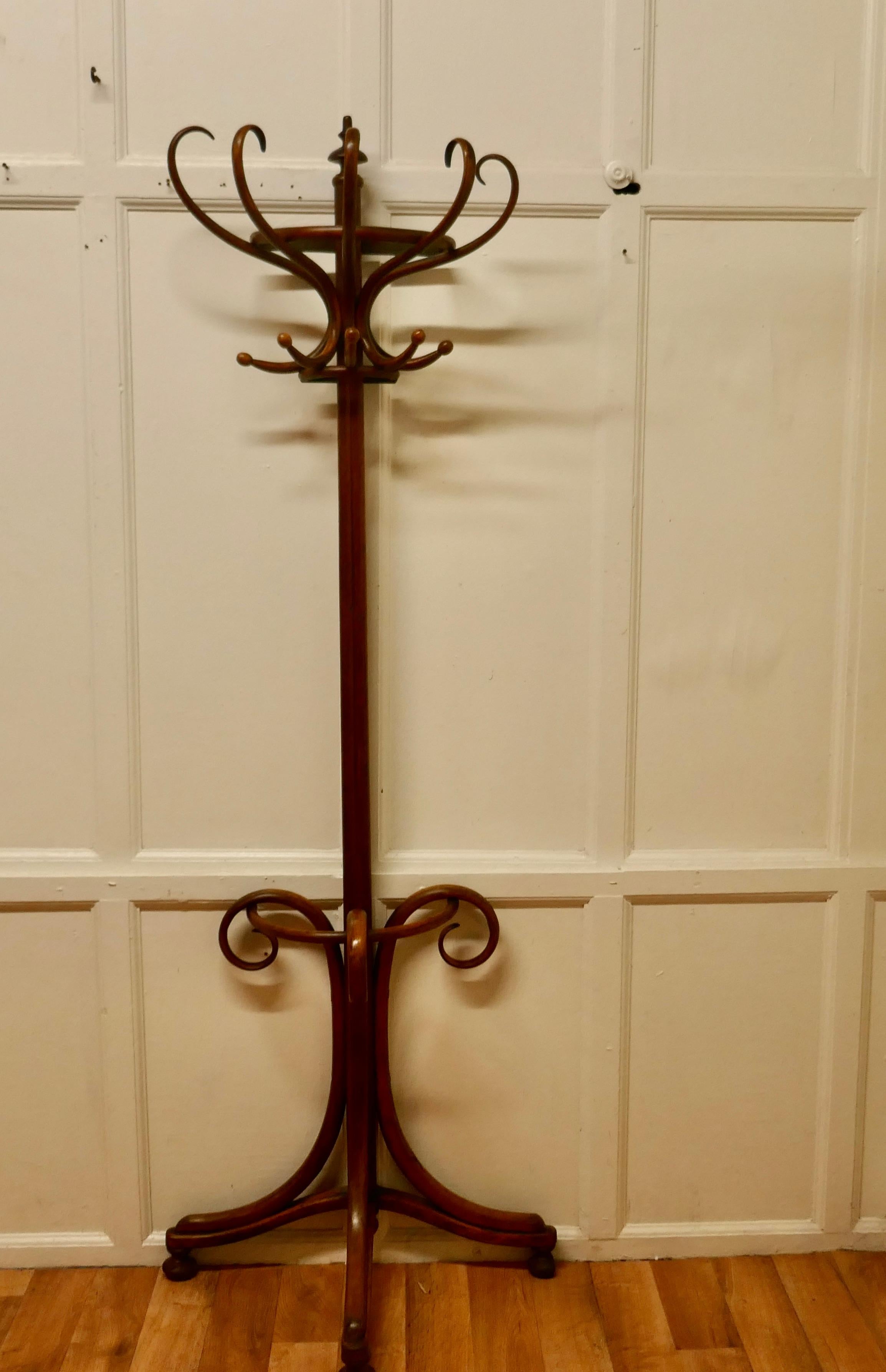 19th Century Bentwood Flat Back Hall Stand

This is an Unusual Large Half Round Hat & Coat Hall Stand, it sits flat against a wall it has 5 Large Curved Bentwood Hat & Coat Hooks at the top and 3 large scrolling Legs forming the umbrella