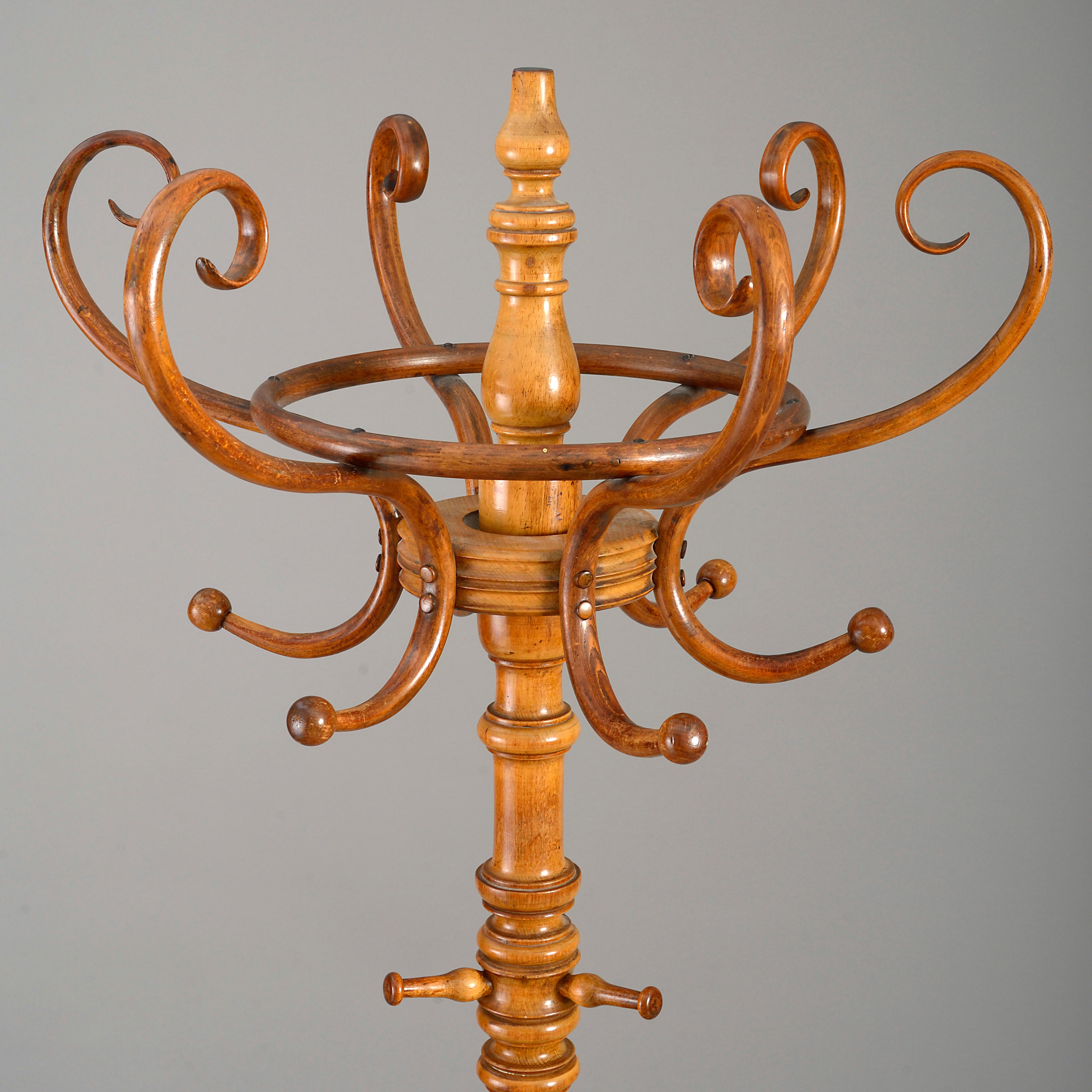 An elaborate late nineteenth century turned beech and bentwood hat and coat stand. Attributed to Thonet of Vienna.