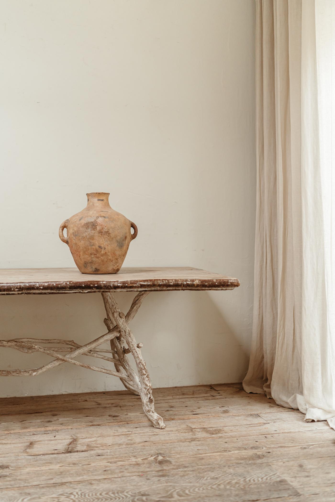 Lovely patina on this mid-19th century terra cotta berber vase/urn. Wonderful decorative object.