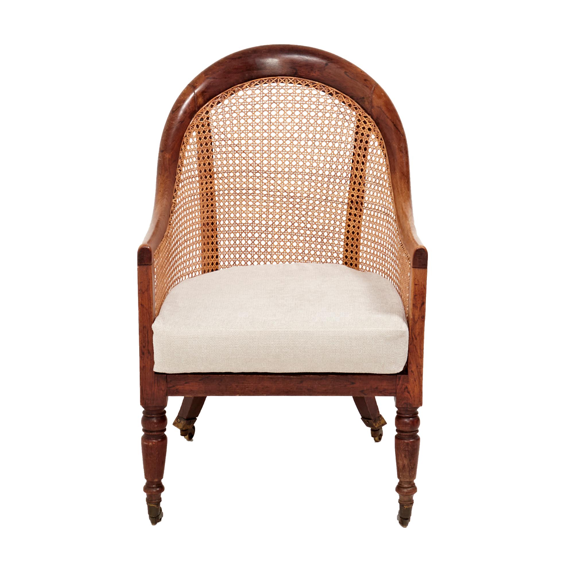 A stunning bergère stained beech armchair.

The chair features the original caning on the backrests and arms while the seat cushion has been newly reupholstered in soft grey fabric for the ultimate comfort.

The legs of the chairs feature unique