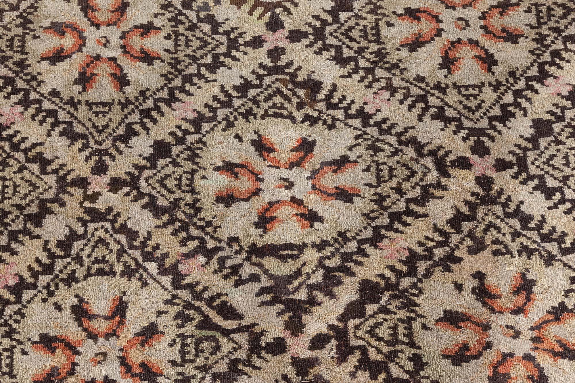 19th century Bessarabian beige and brown handmade wool rug.
Size: 11'2