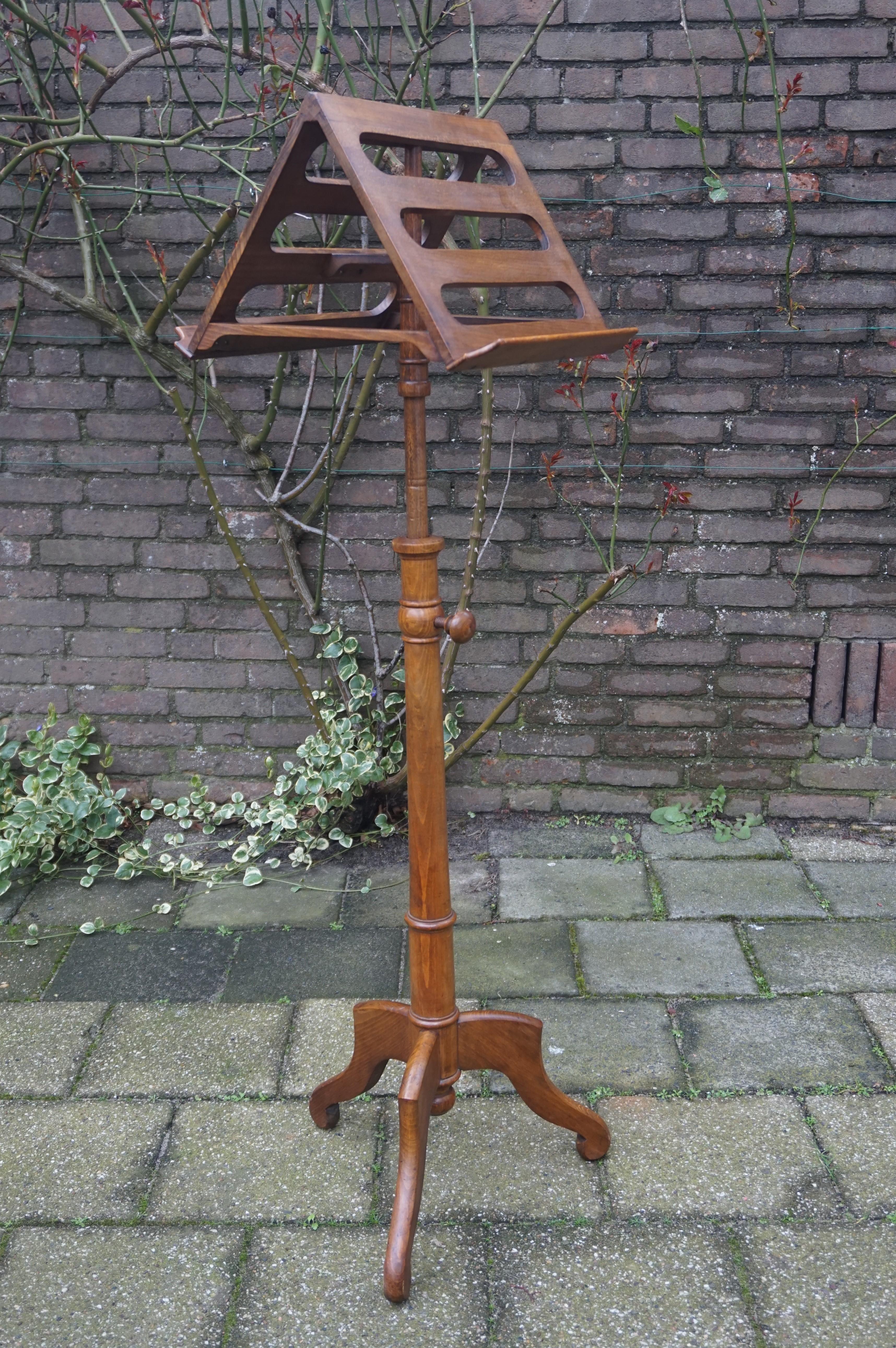 Antique and stunning stand for sheet music or books.

This antique musicians stand is not only in excellent condition, it also is highly practical and a stylish piece to look at. It is adjustable in height, it is dismountable, it stands as strong