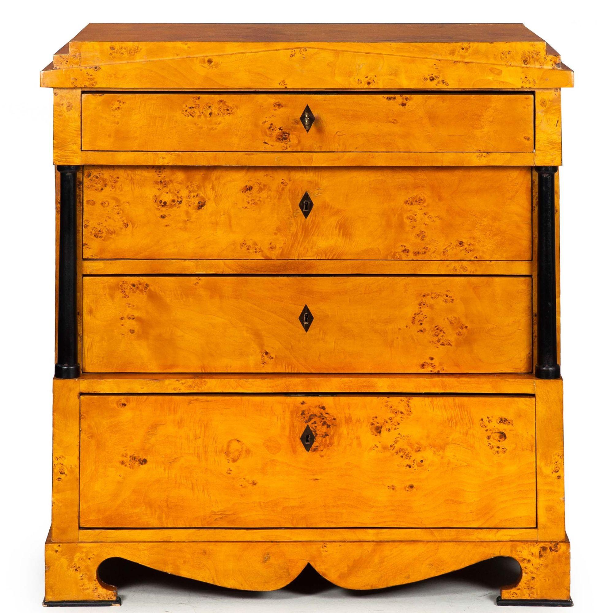 BIEDERMEIER PARCEL-EBONIZED BIRCH ARCHITECTURAL CHEST OF DRAWERS
Cica early-to-mid 19th century
Item # 310EDO04Q

A lovely Biedermeier commode with a powerful architectural form. It features a triangular pediment projecting from the overall