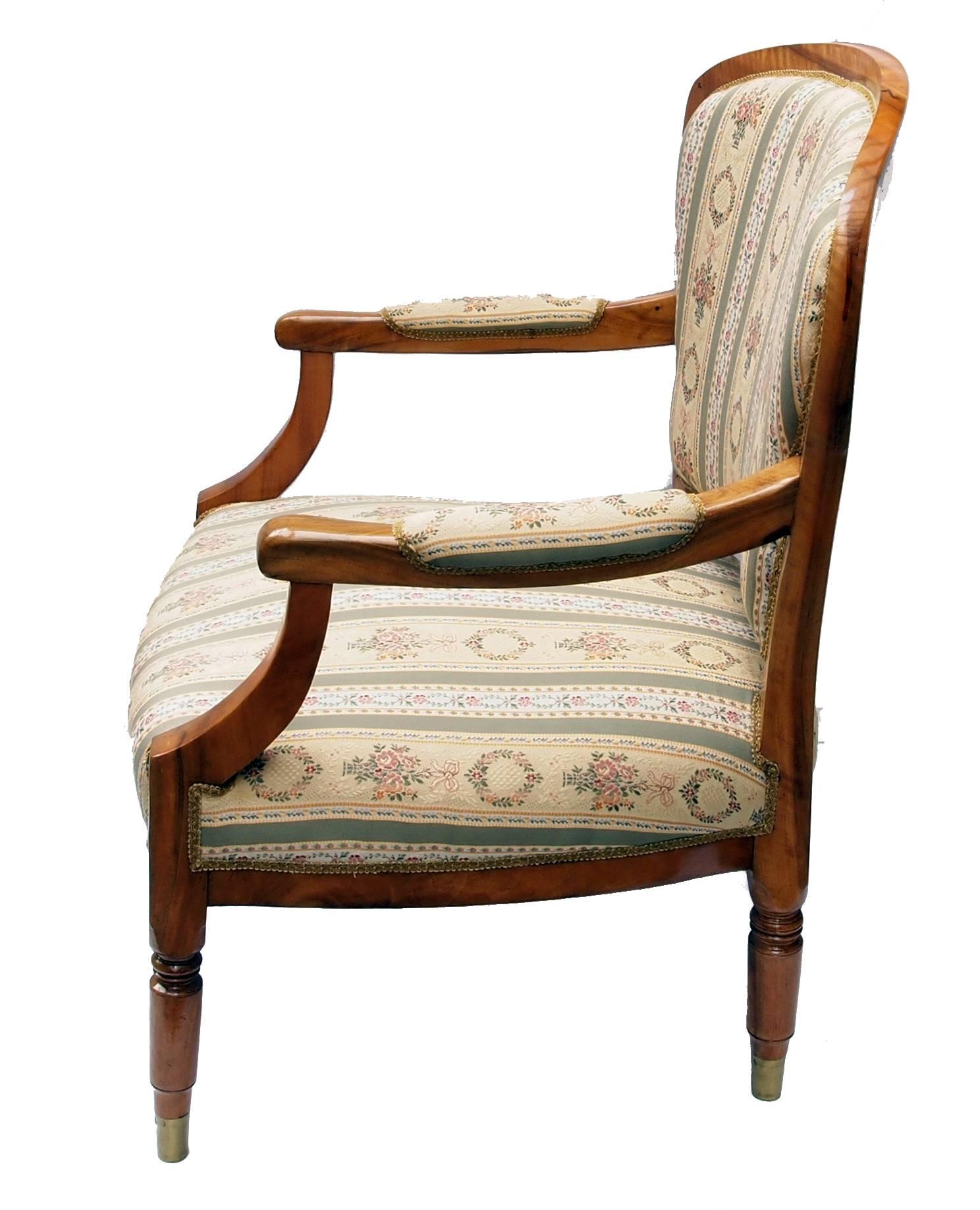 Biedermeier armchair from Germany, very good restorated condition, solid walnut. The feet are with brass shoes.