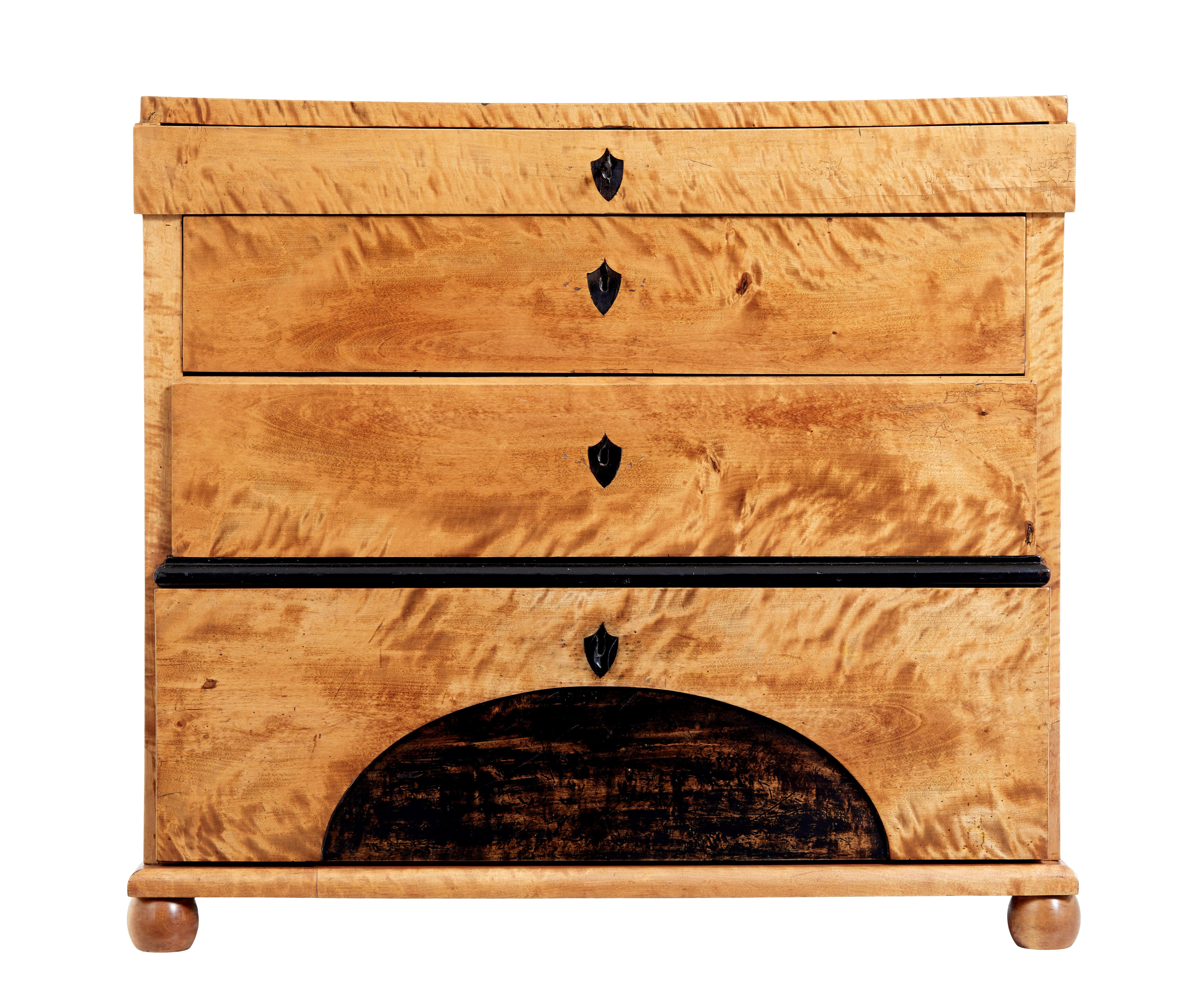 19th century biedermeier birch chest of drawers circa 1830.

Swedish biedermeier commode with plenty of character.

Fitted with 4 drawers of various dimensions.  Top drawer forming part of the stepped detail below the top surface.  Further
