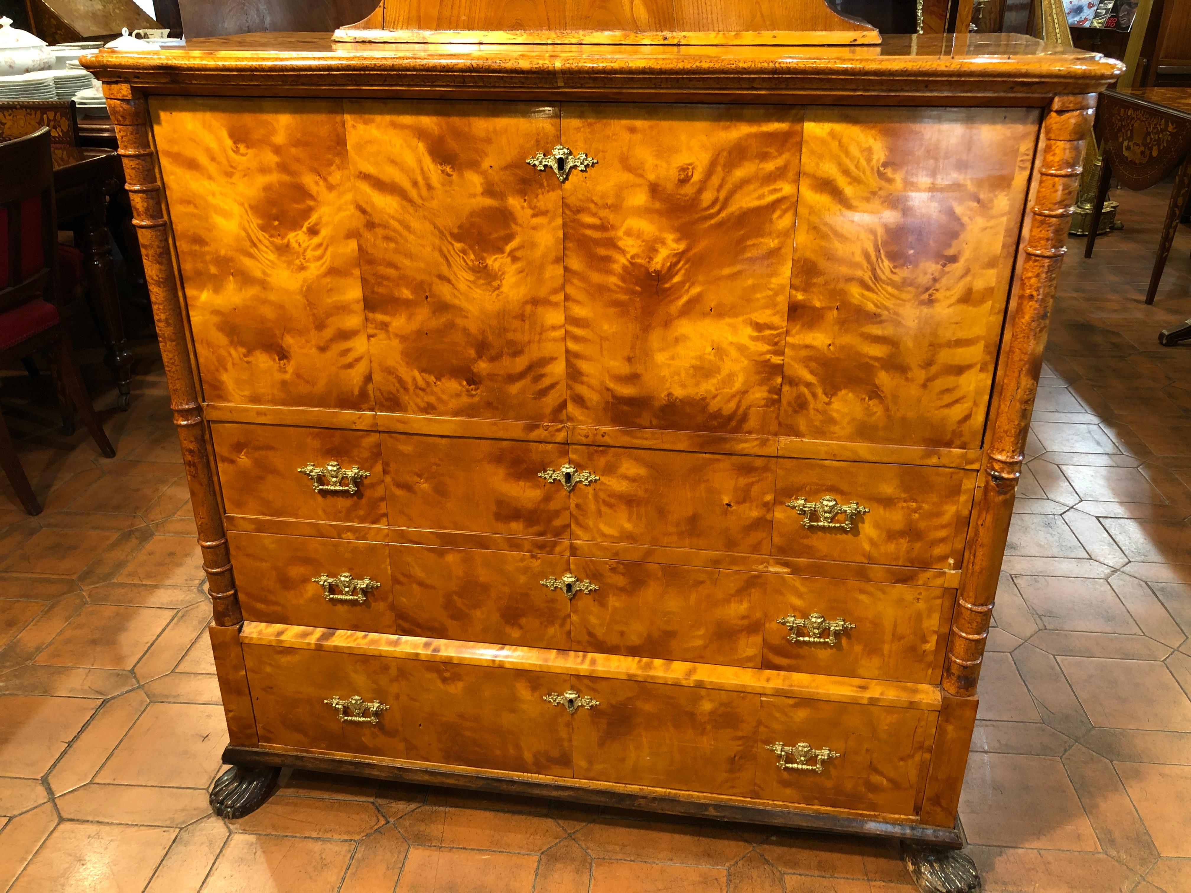 Very rare secretaire with built-in clock, birch, columns and edges in birch burl, dated May 27th, 1867, signed by the cabinetmaker. In the inside drawer there is a secret drawer. Finely inlaid and carved interior. The first two drawers are cut out