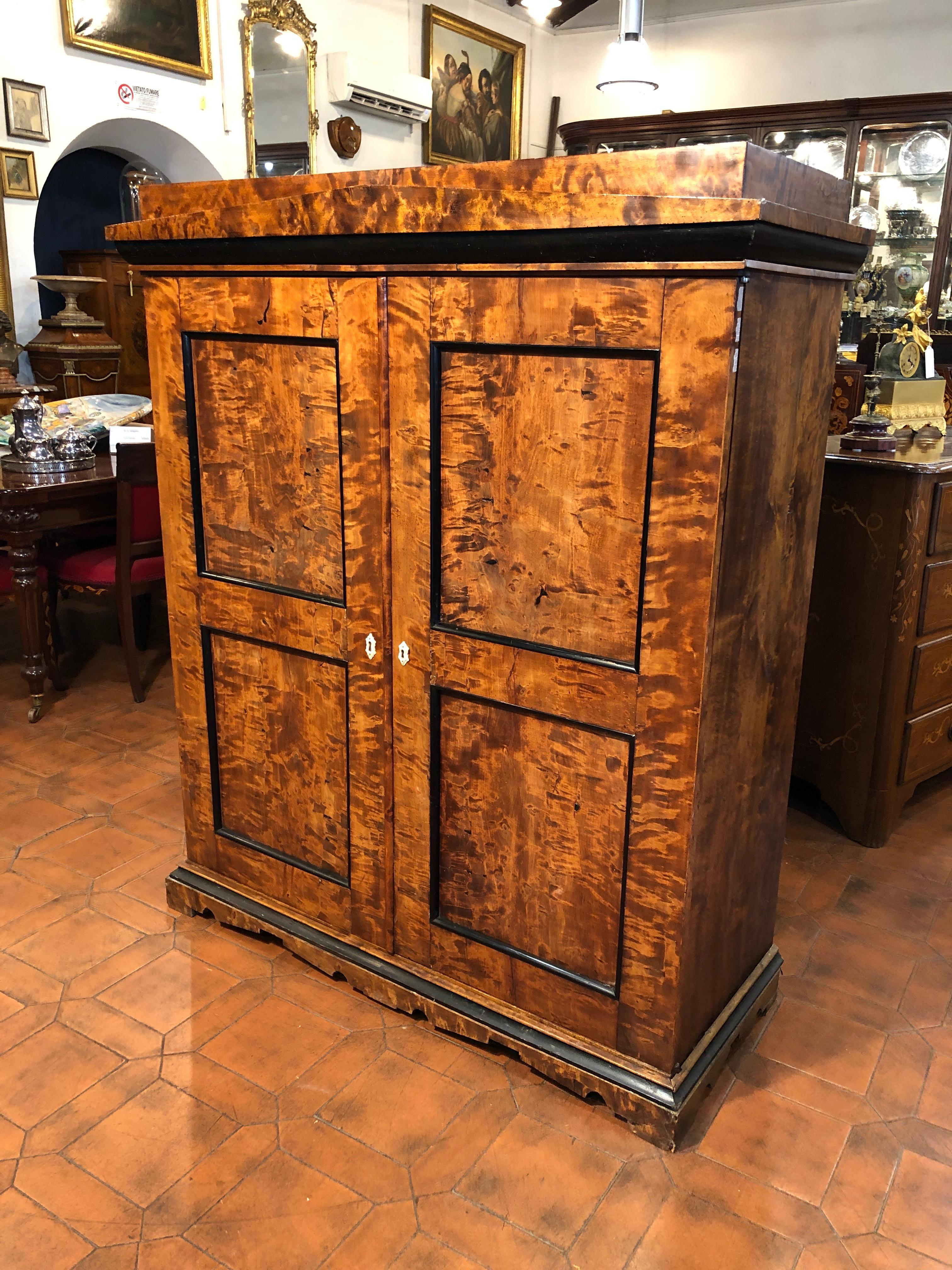 Rare Biedermeier furniture, seeing it looks like a small cabinet, opening the doors we are on the right side a small, elegant, Secretaire, while on the left side a small wardrobe. Small but incredibly useful. The plan hides a secret compartment that