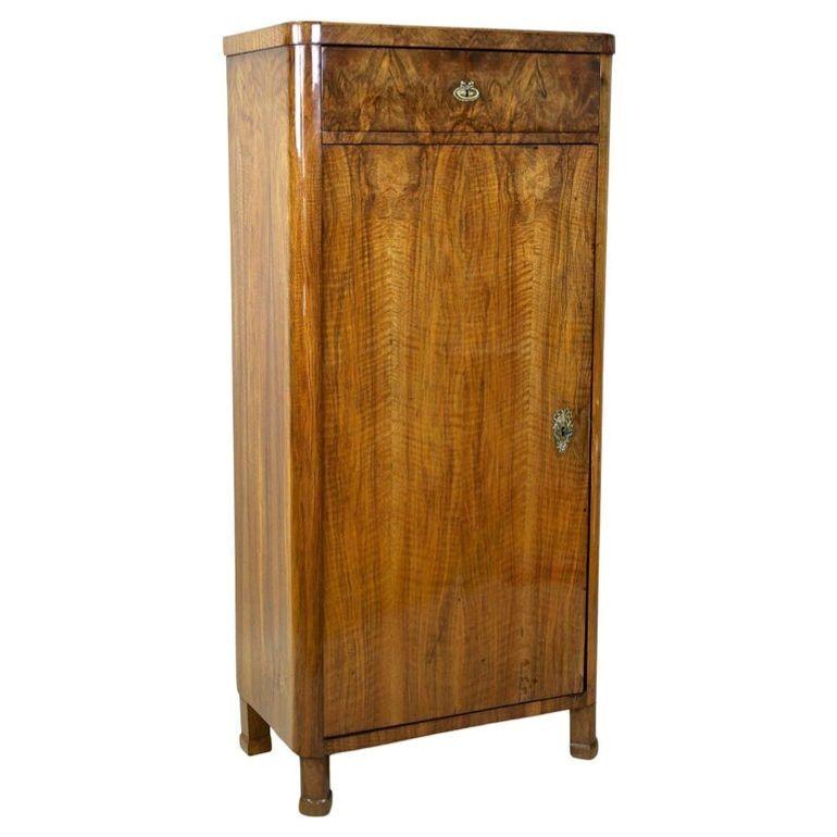 Fantastic, newly restored 19th century Biedermeier nutwood cabinet from the wellknown period in Austria around 1850. Adorned by an amazinglooking mirror matched nutwood veneer work, this antique Biedermeier cabinet provides a large lockable door