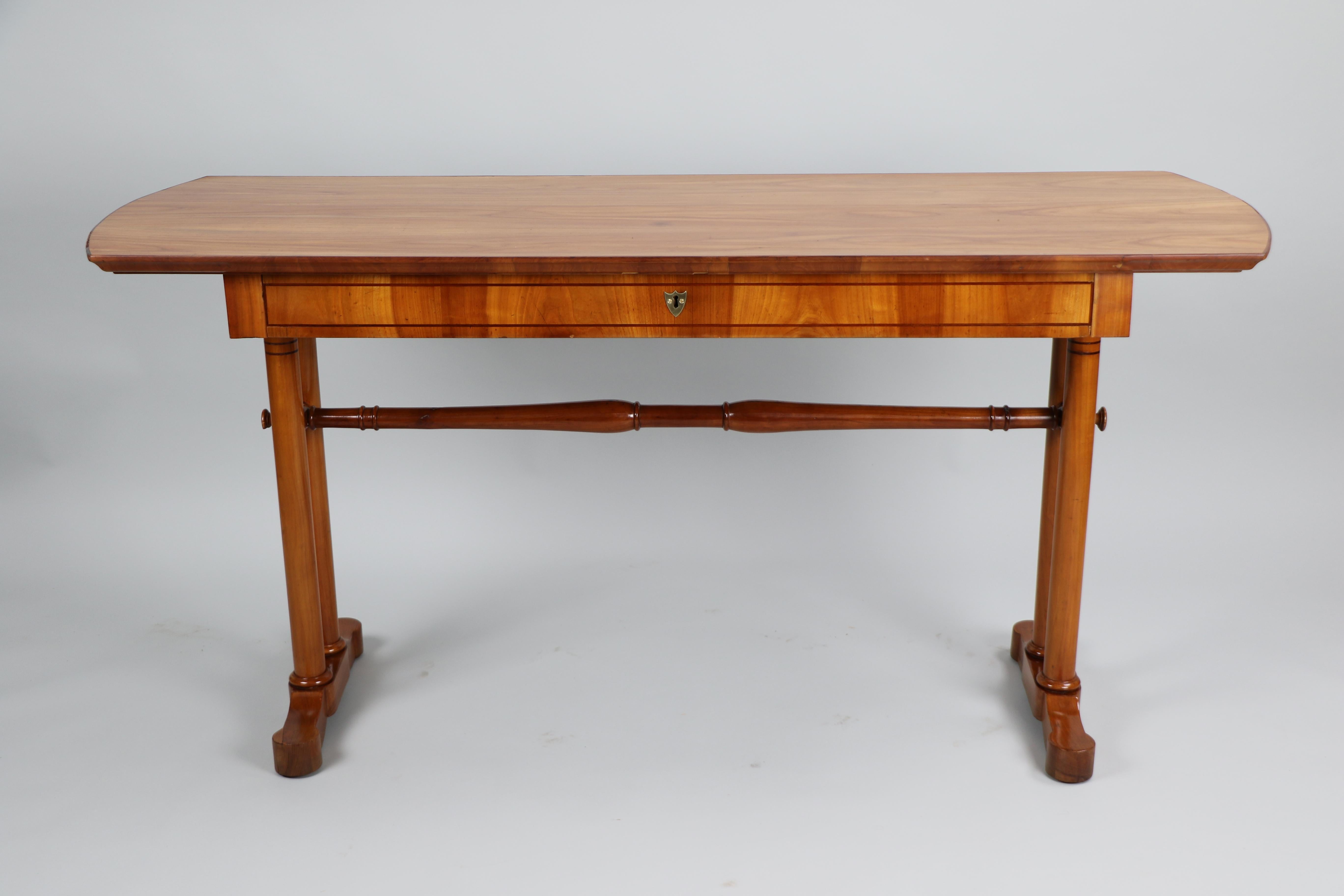 Hello,
This exceptional Viennese Biedermeier cherry console side table was made circa 1825.

Viennese Biedermeier is distinguished by their sophisticated proportions, rare and refined design and excellent craftsmanship and continue to have a great