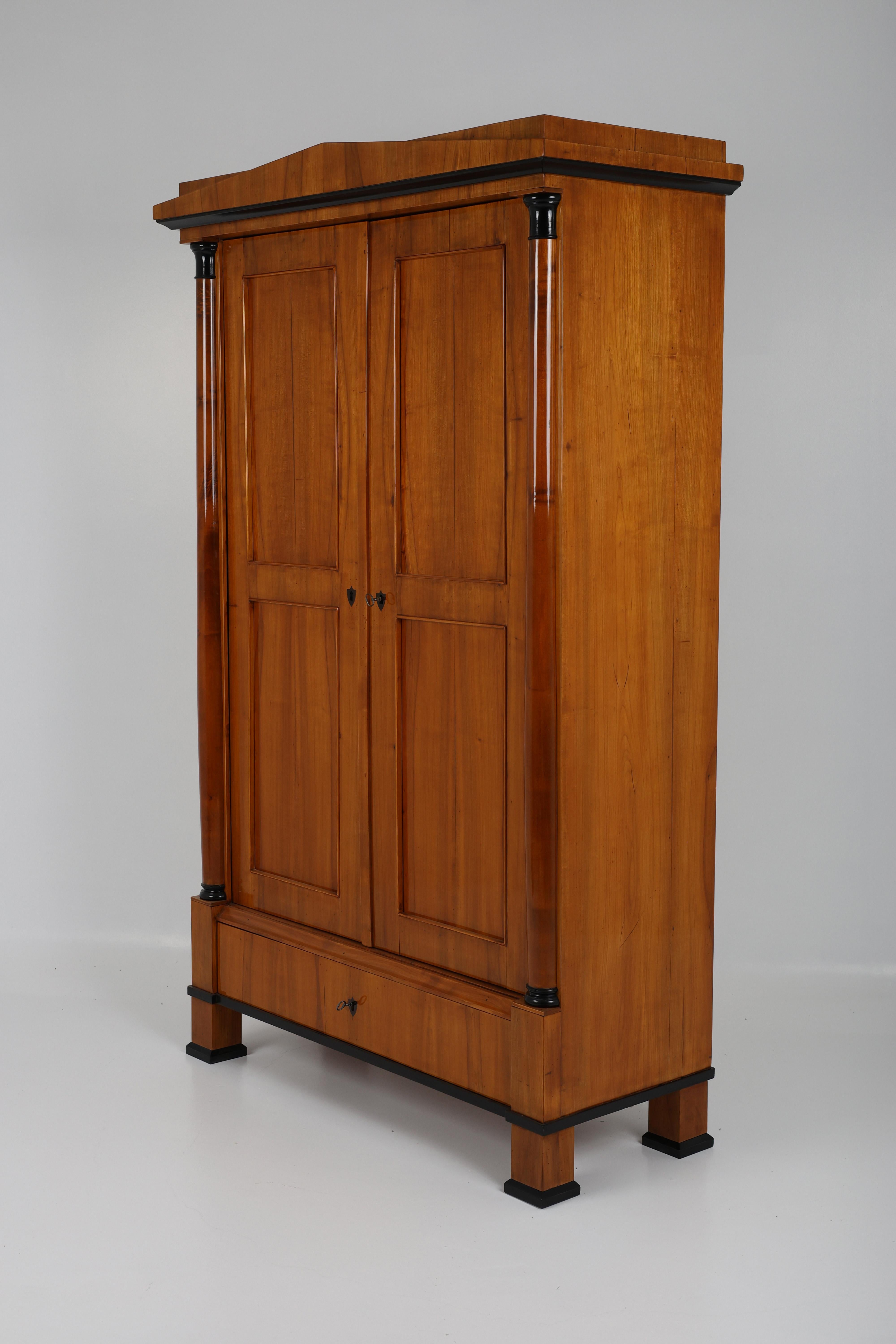 19th Century Biedermeier Wardrobe,
Germany, 1820
Cherry wood,

A remarkable 19th-century two-door wardrobe from the Biedermeier period, originating from Southern Germany around 1820. This exquisite piece showcases the elegance and functionality