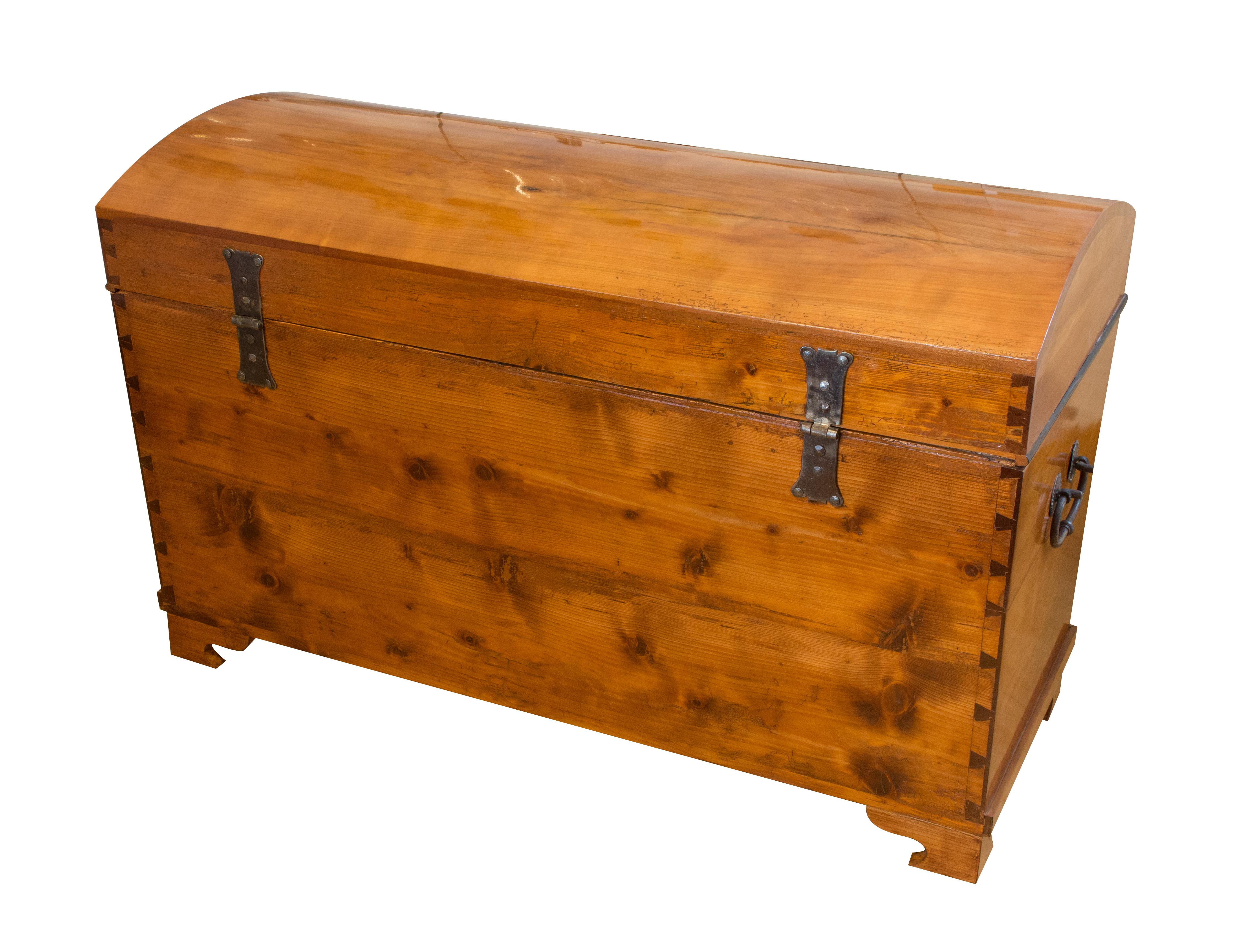 Very nice dome-top chest / trunk from the time of the Biedermeier, circa 1820. The chest is made of solid cherrywood, the back wall is made of pine wood. The hinges, the lock and the handles are original from the Biedermeier period. Front-Handle and