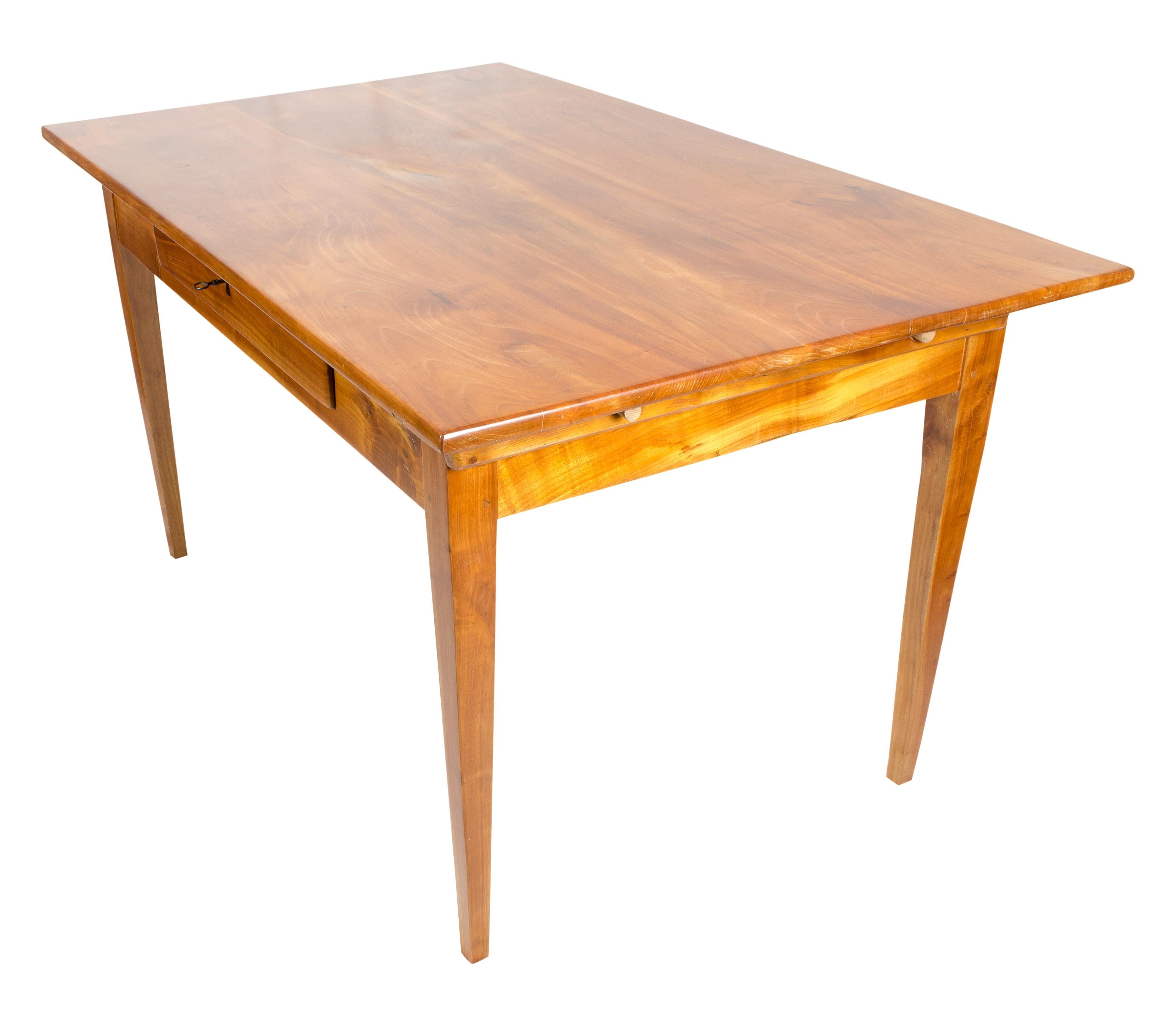 Solid cheerywood farmhouse table from the time of Biedermeier, circa 1830 with one drawer in the middle. In very good restored condition. 

Space between frame and floor: 59.5 cm.
  