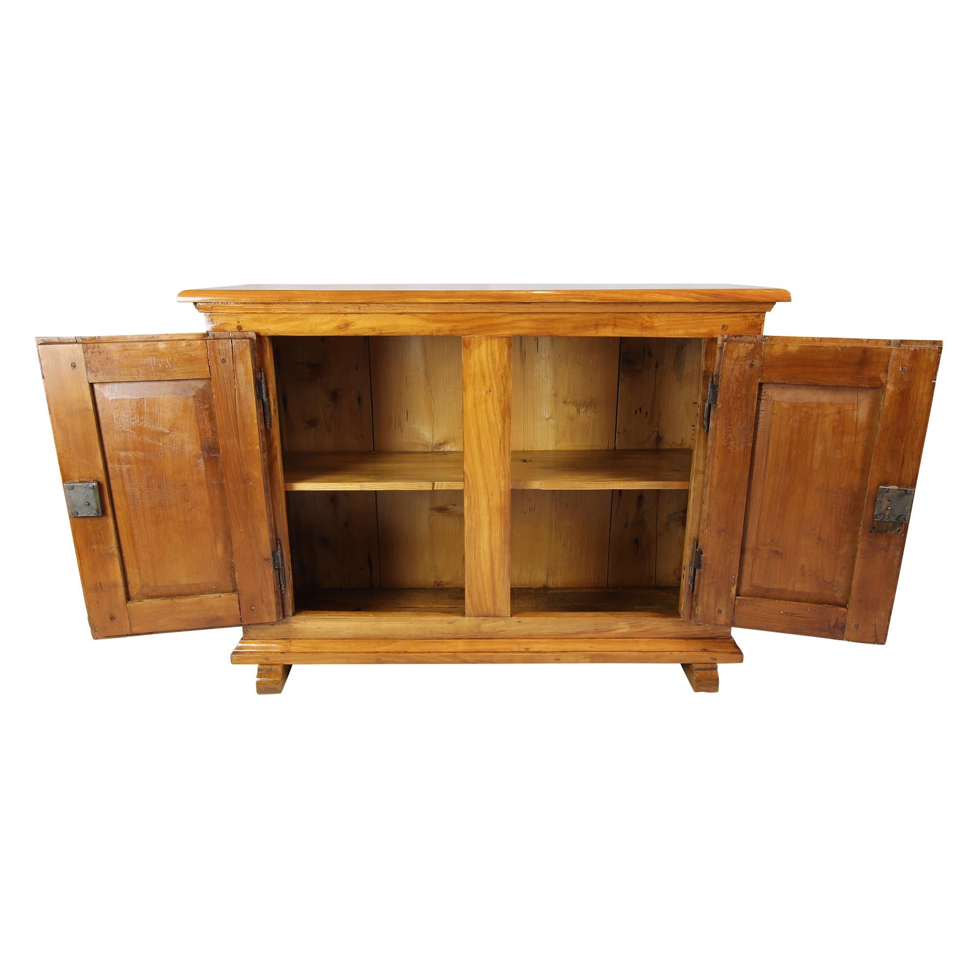The small sideboard made of solid cherry comes from the South of Germany. The sideboard has a very practical small rare measure. It comes from the Biedermeier period around 1825.