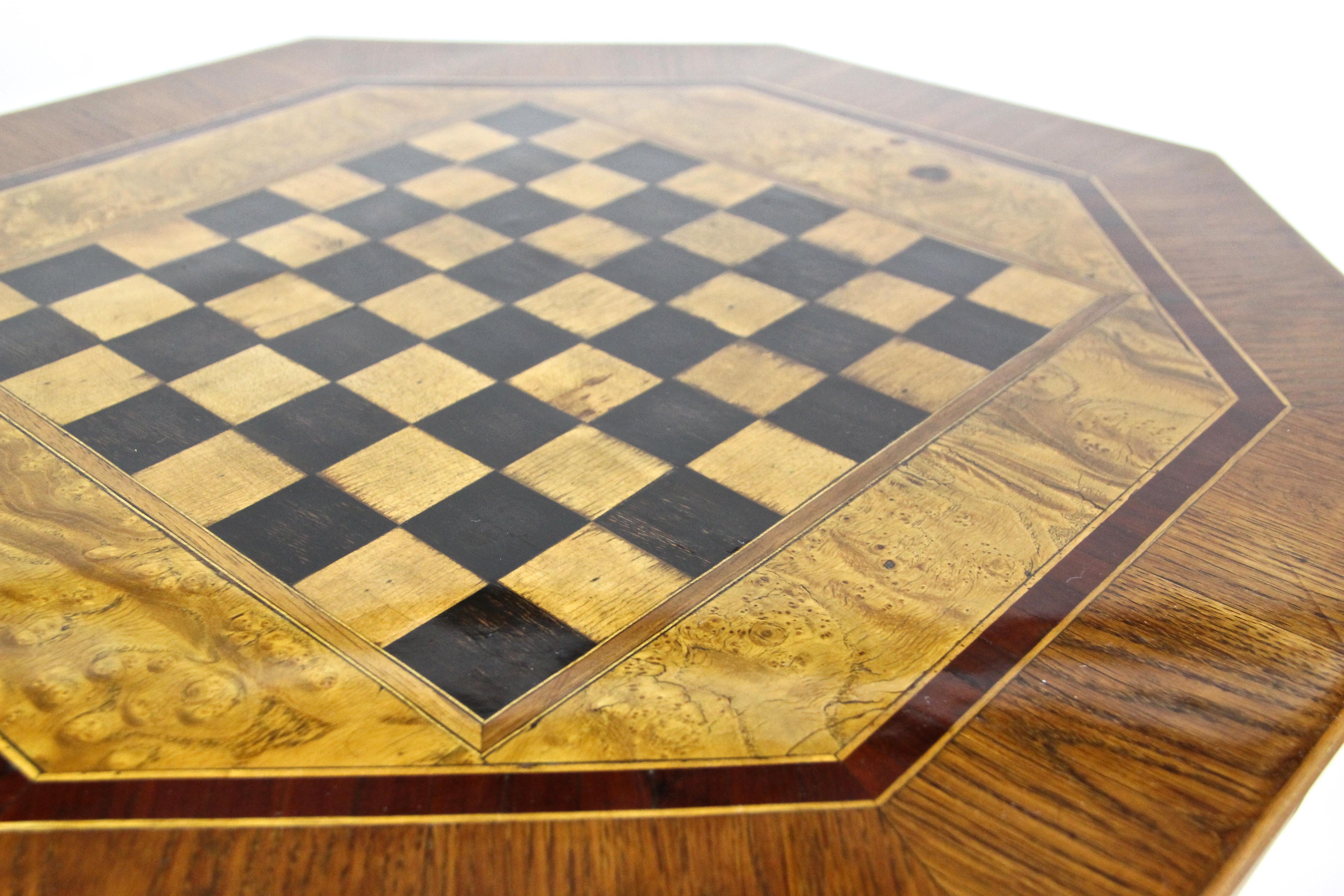 Exclusive Biedermeier chess table from the period in Austria, circa 1840. The substructure, made of spruce wood, was veneered with very thick oakwood in a beautiful manner. A fantastic octagon shaped design runs from the base up to the top showing