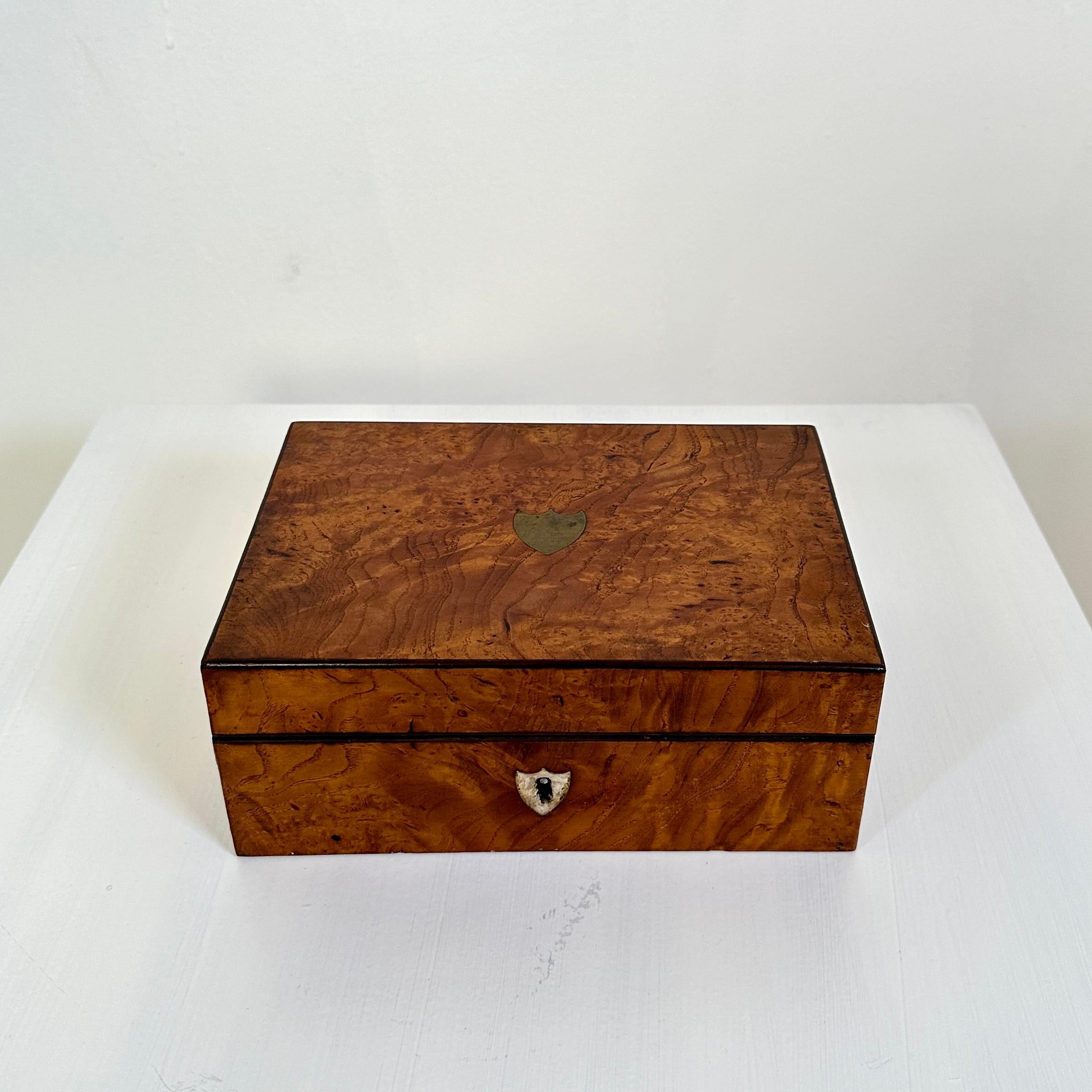 This beautiful 19th Century Biedermeier Jewelry Box was made in burl walnut around 1820.
It is made out of pine and veneered in burl walnut and the inside is covered in blue velvet.
Great vintage antique condition.
A unique piece which is a great
