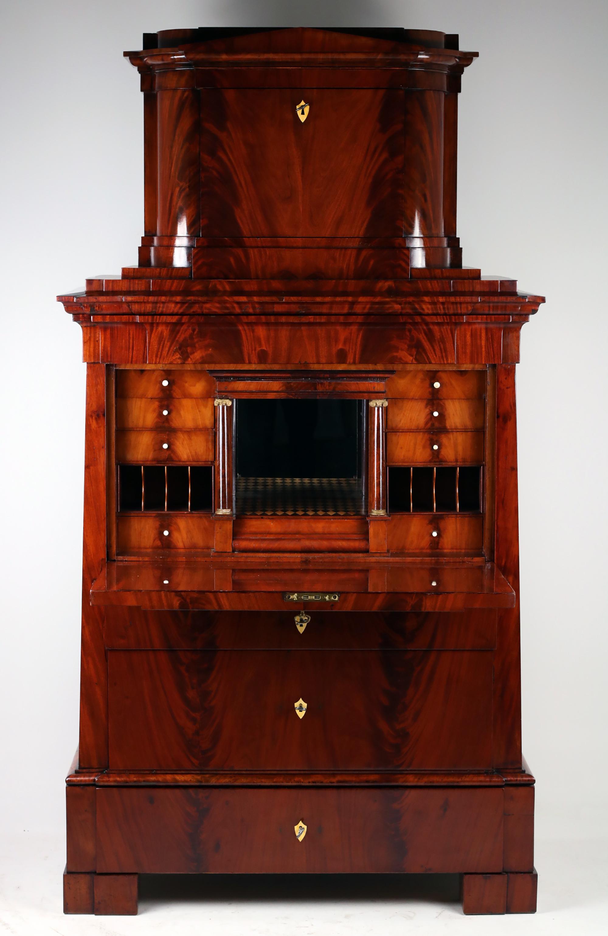 19th Century Conical Shape Secretary,
Germany, 1820

This fine Biedermeier secretary made of mahogany is a real gem for every lover of antique furniture. With a height of 194 cm, a width of 106 cm and a length of 52 cm, it offers plenty of storage