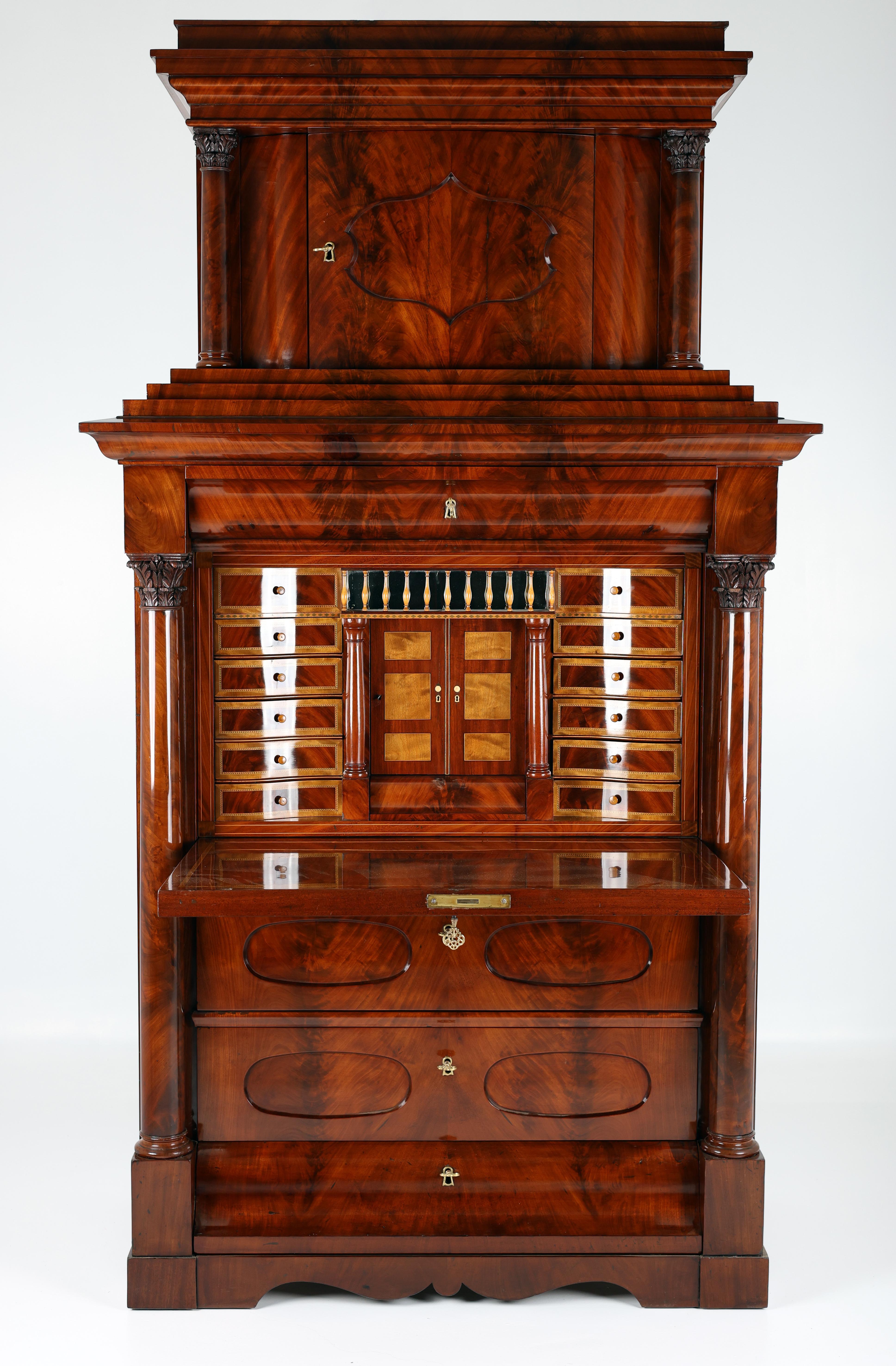 19th-Century Biedermeier Secretary 
Date of Origin: 1825–1830, (Germany, Berlin)
Material: Pyramid Mahogany

This extraordinary 19th-century Secretary with an upper cabinet, crafted in the distinguished Biedermeier style, epitomises the delicate