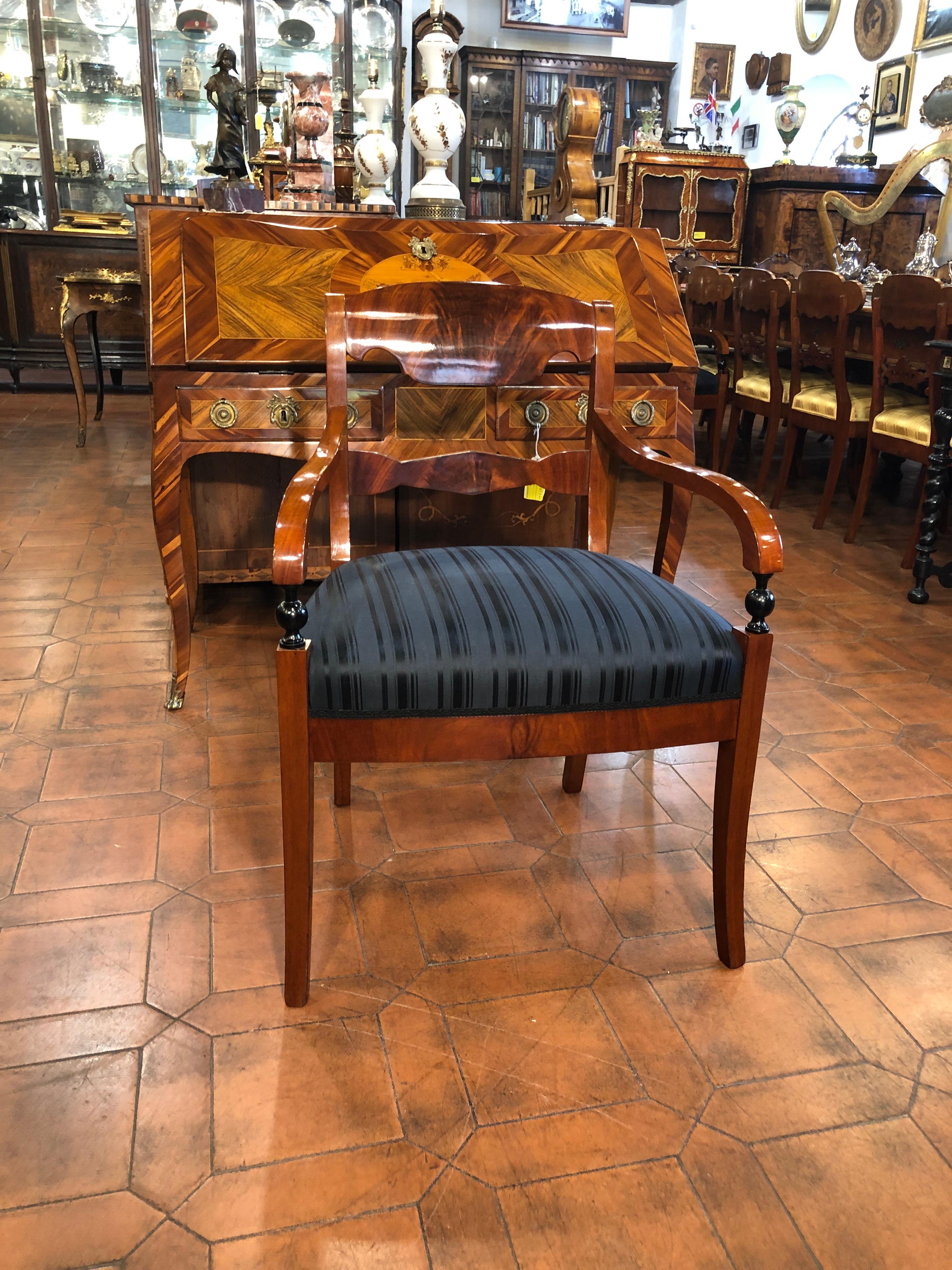 Wonderful set of four Biedermeier armchairs, restored and upholstered, in mahogany with parts and ebonized profiles. Great quality. Example of class, elegance and simplicity of the Biedermeier style. Easily inserted in a modern context. Period